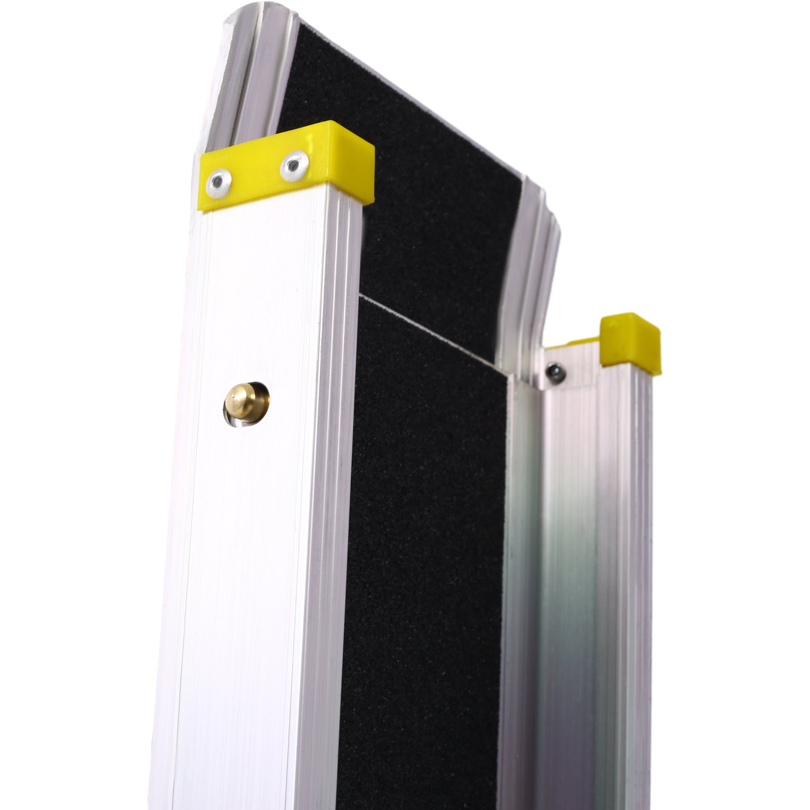 Closeup of an aluminum portable ramp with black antislip surface and yellow corner guards