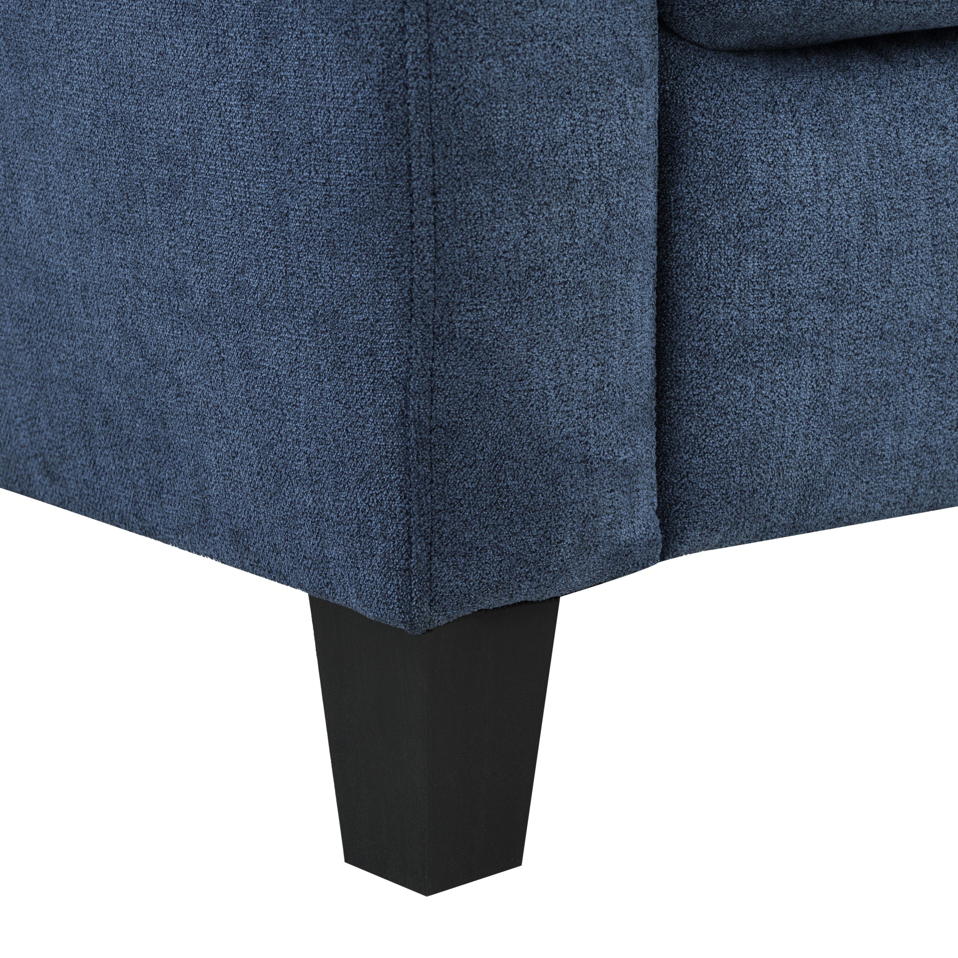 Dark blue textured fabric sofa armrest with a modern black square leg