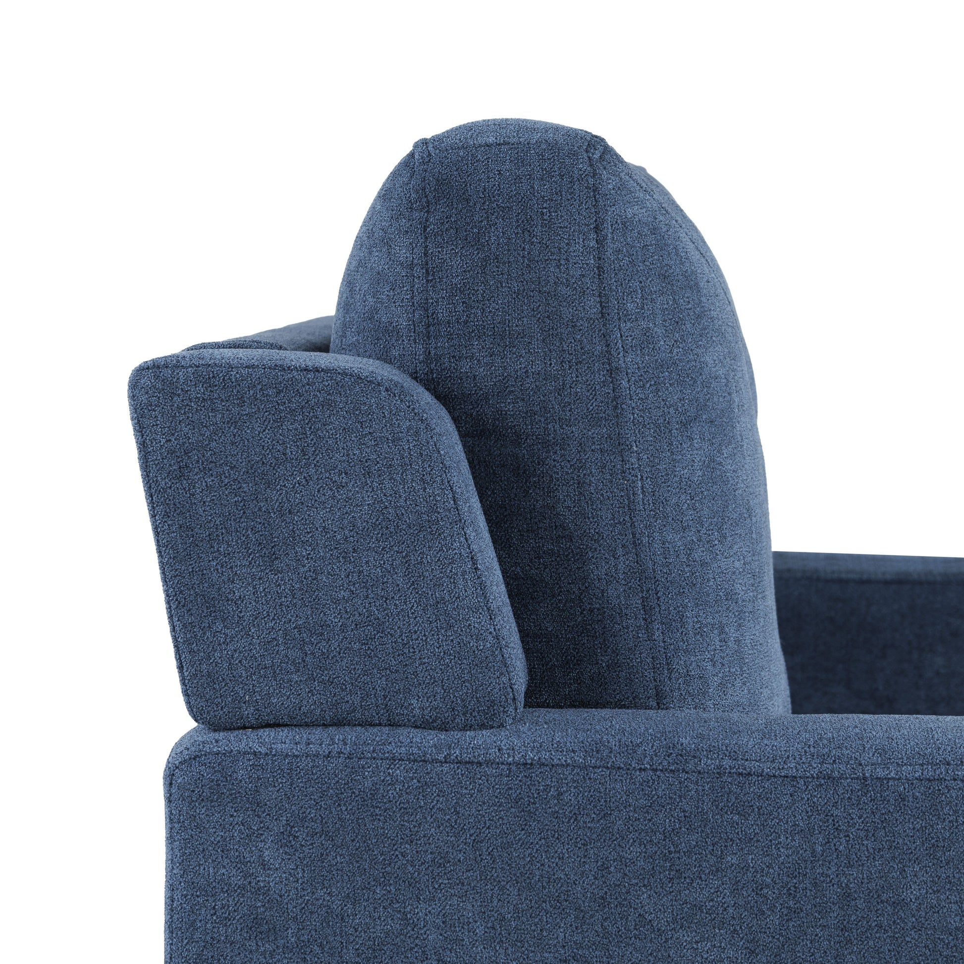 Close up of textured navy blue sofa armrest and back cushion detail
