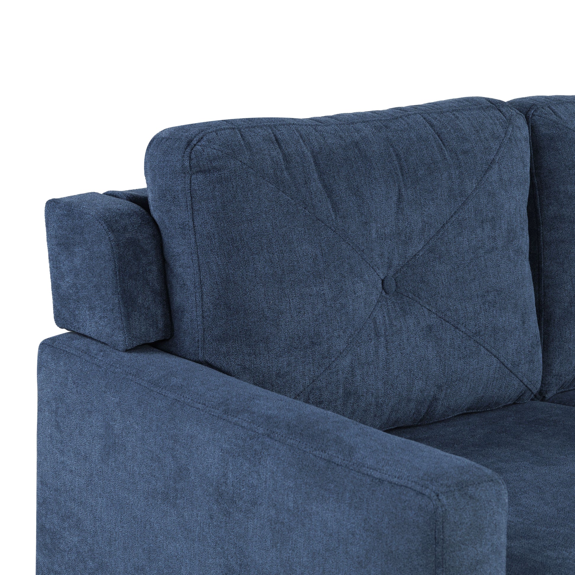 Dark blue textured fabric couch armrest and tufted cushion closeup detail