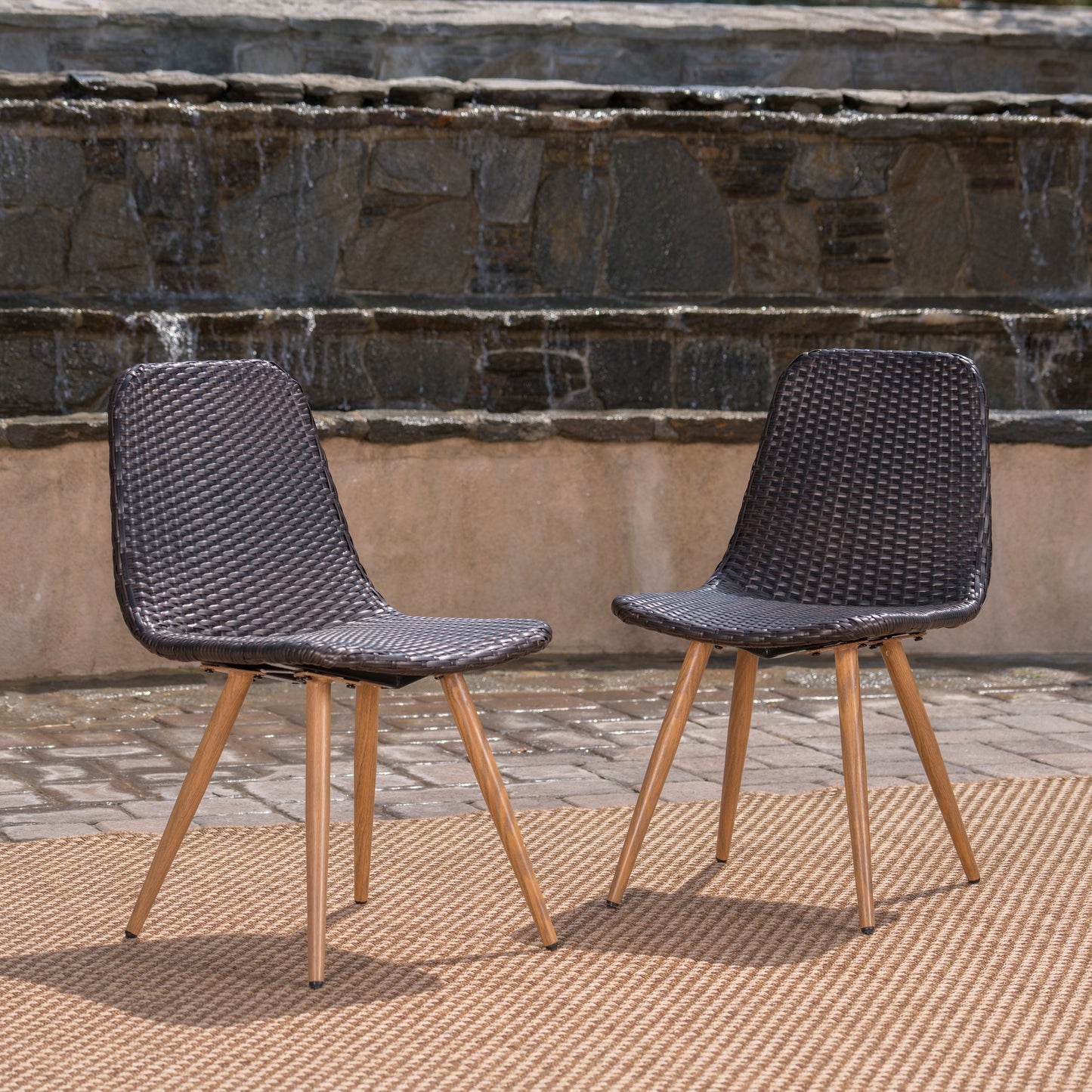 Dark brown wicker outdoor chair with natural wood legs