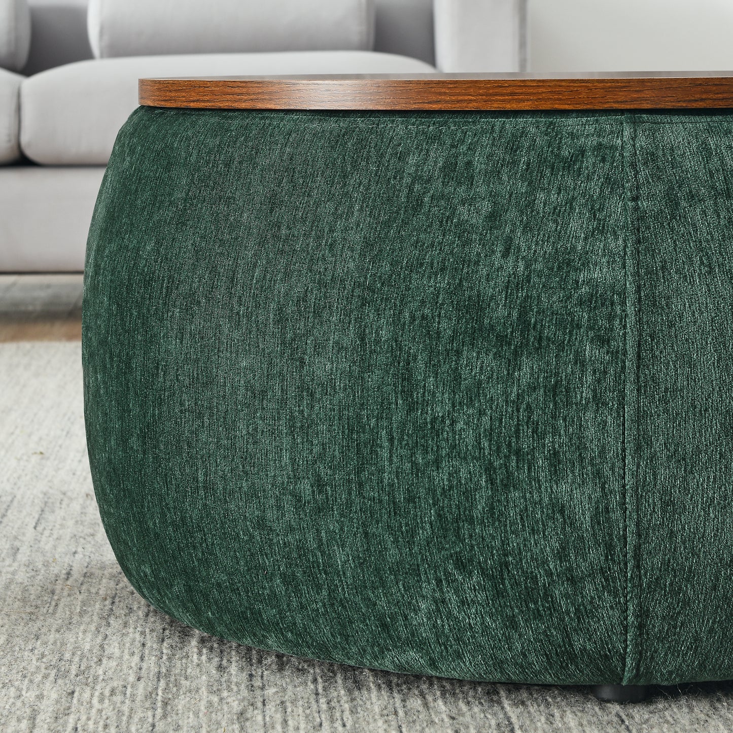 Deep green textured fabric ottoman with dark wood top