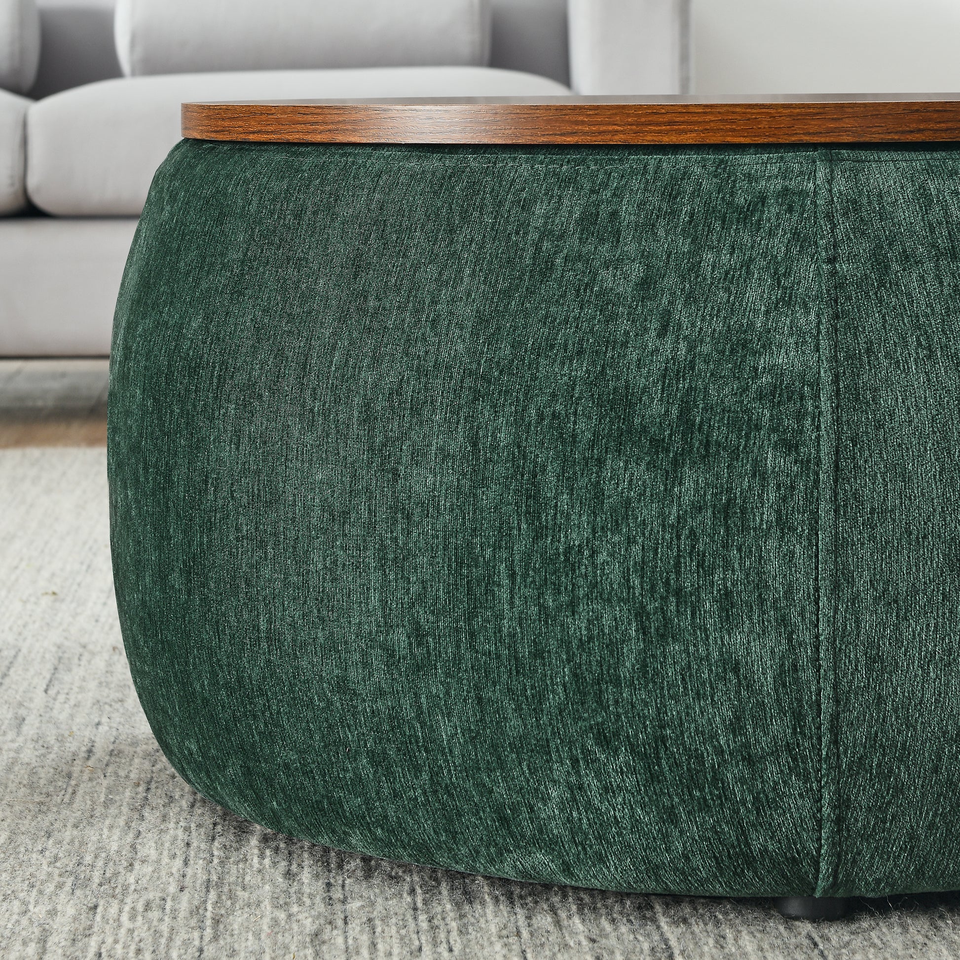 Deep green textured fabric ottoman with dark wood top