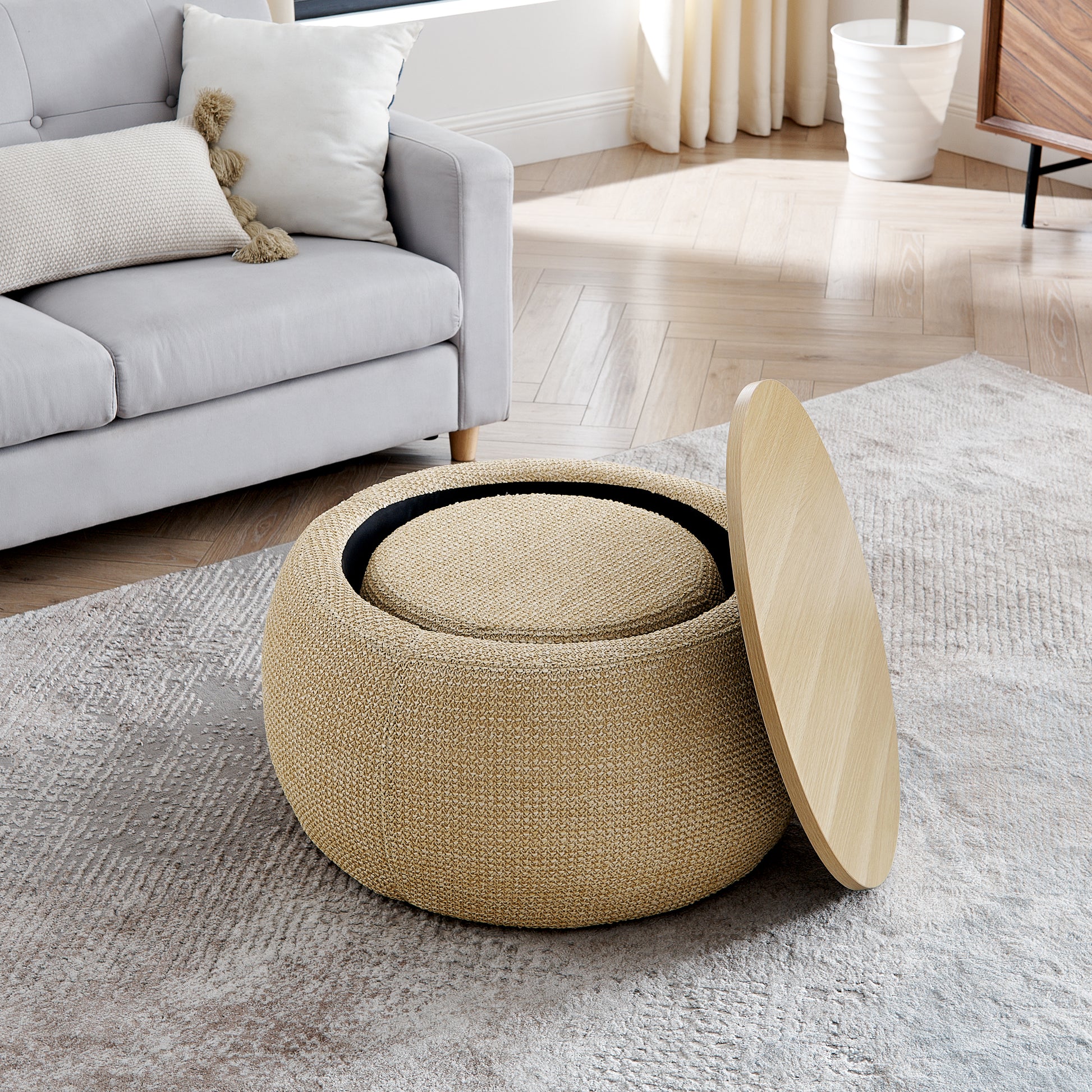 Round woven storage ottoman in natural beige with a light wood lid perfect for living rooms