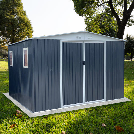 Dark gray metal storage shed with double doors and two windows on a concrete base