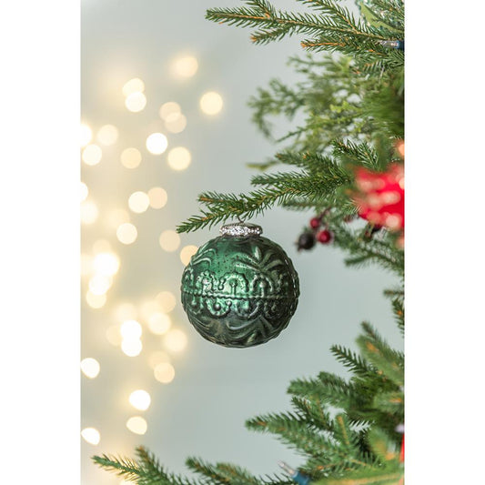 Vintage style emerald green glass Christmas ornament with intricate embossed detail
