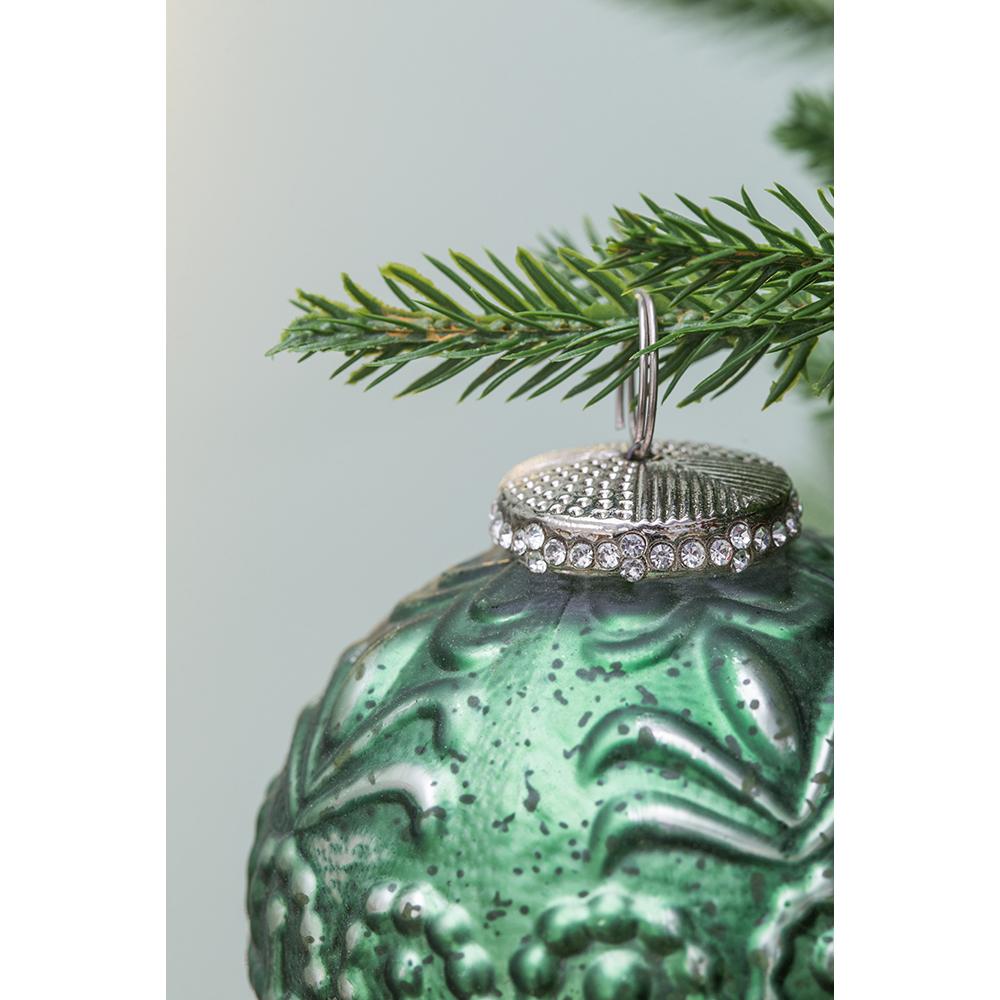 Antique green glass Christmas ornament with ornate silver cap and rhinestones