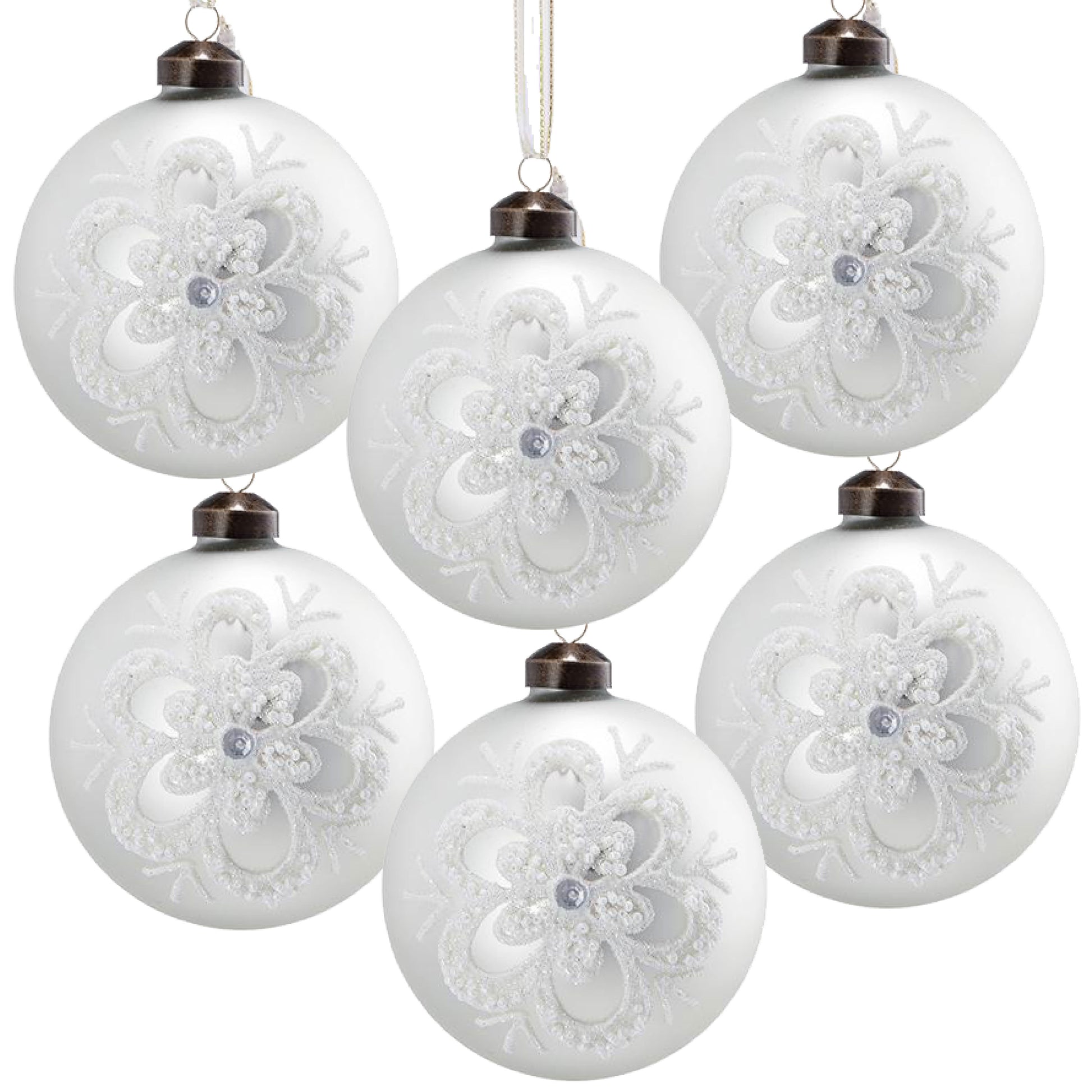 Set of  frosted white glass Christmas ornaments with intricate snowflake designs and silver center gem