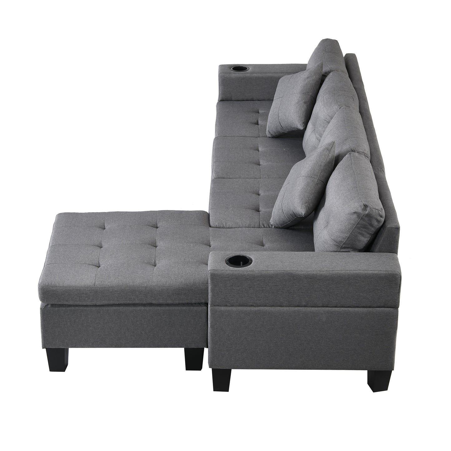 Dark grey tufted sectional sofa with chaise cup holders and accent pillows