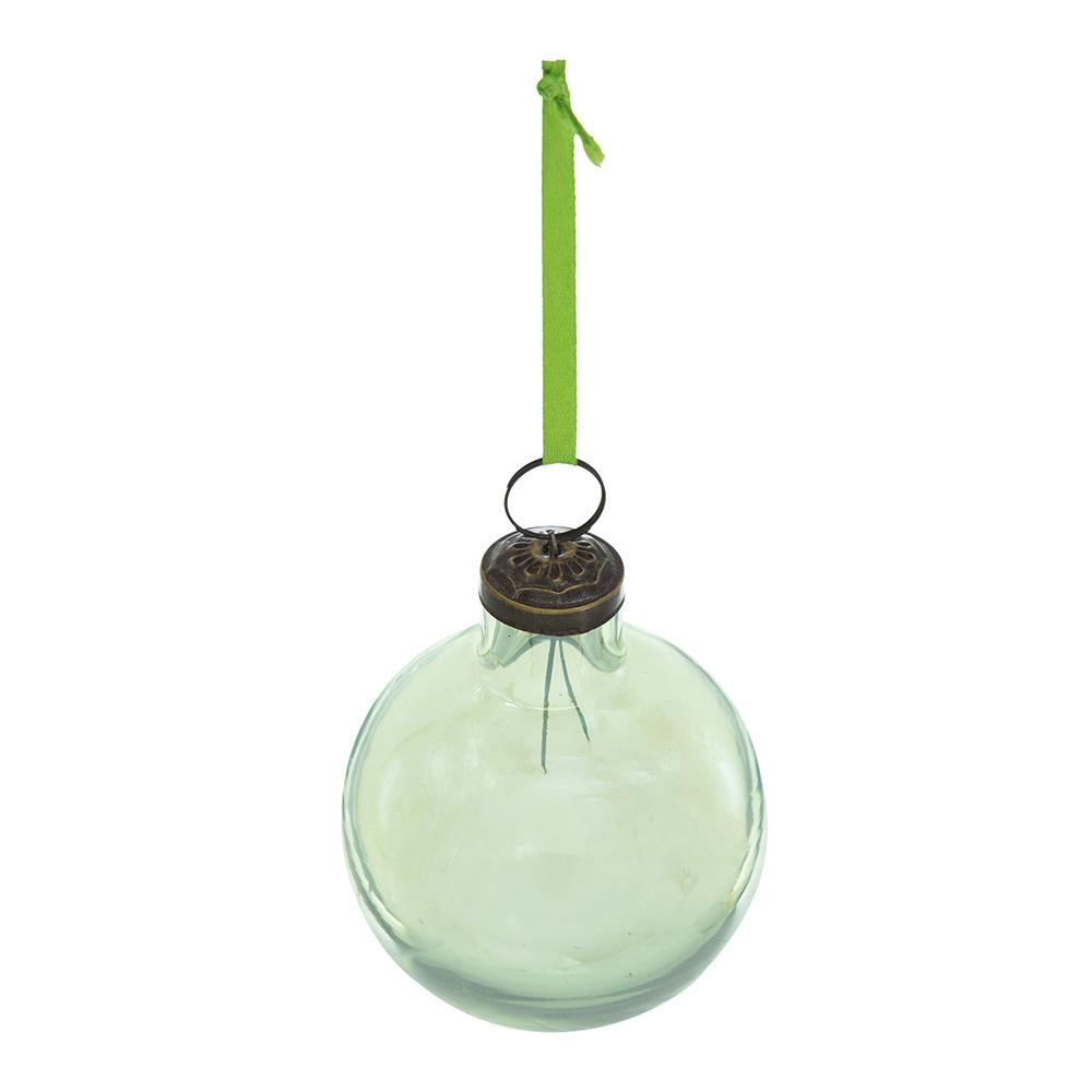 Clear glass Christmas ornament with antique brass cap and green ribbon hanger