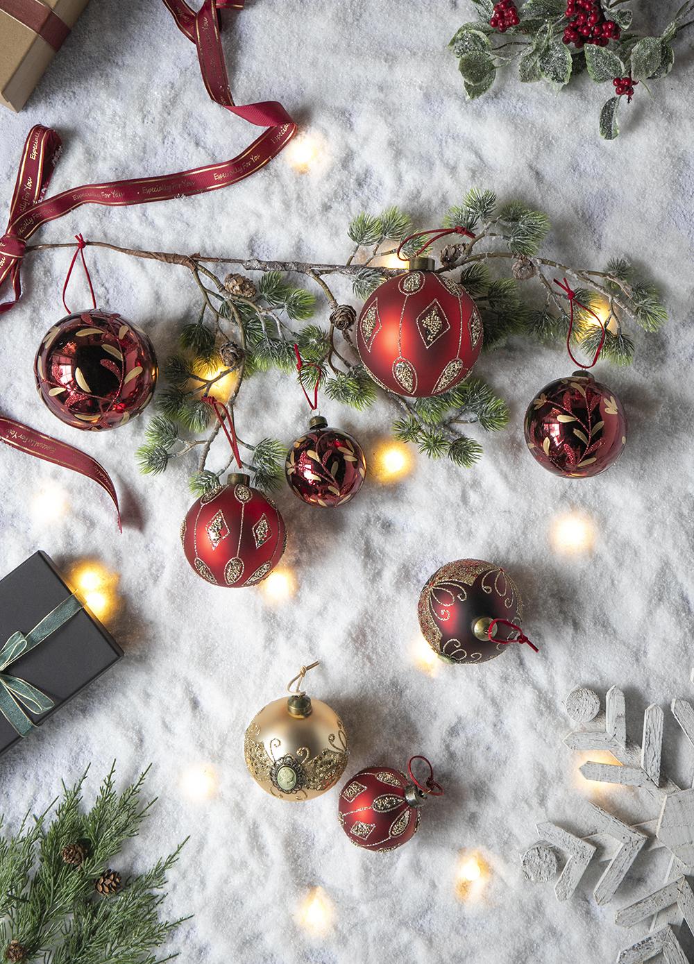 Red glass Christmas ornaments with gold glitter diamond patterns