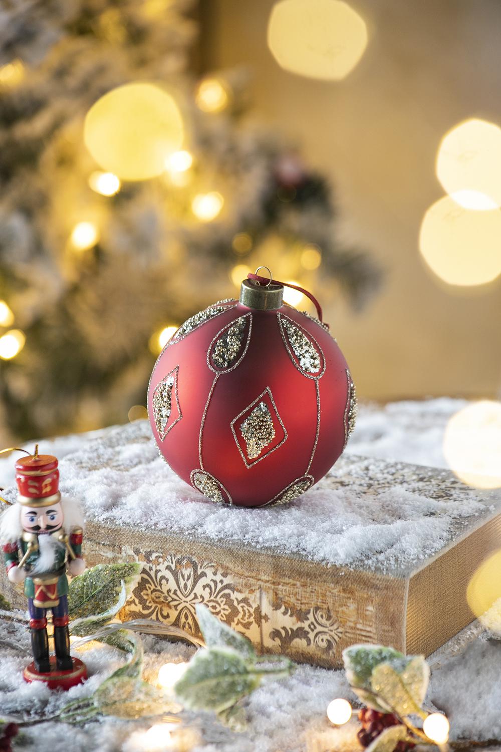 Matte red Christmas ornament with gold glitter diamond pattern