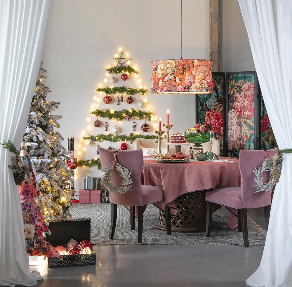 Flocked artificial christmas tree with fairy lights and classic ornaments