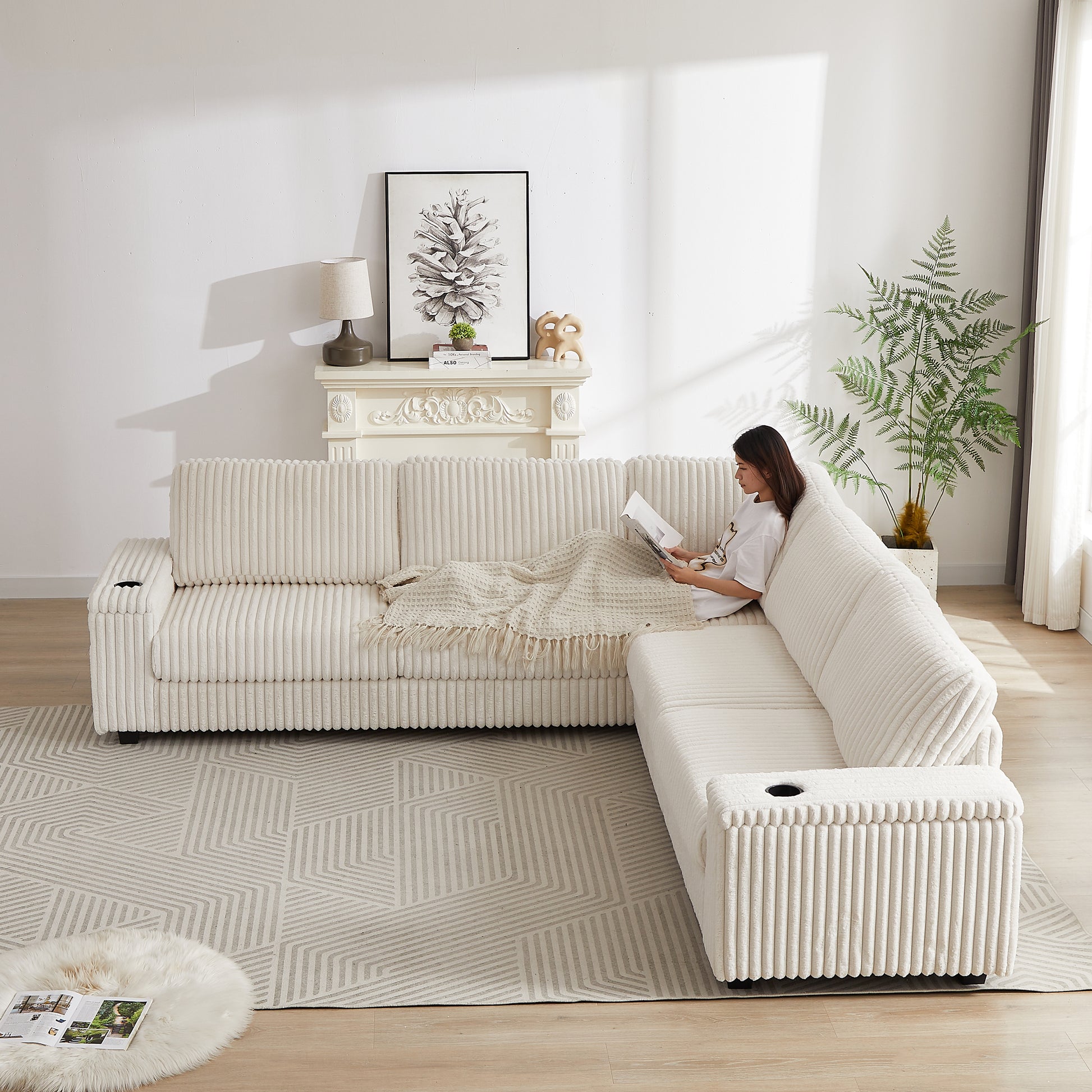 Cream corduroy sectional sofa with plush fabric and integrated cup holders for modern living rooms