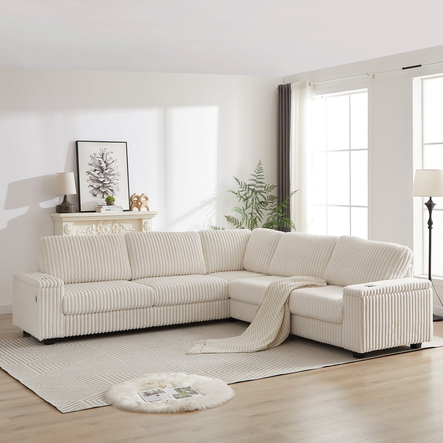Cream corduroy sectional sofa with plush cushions and a woven throw blanket