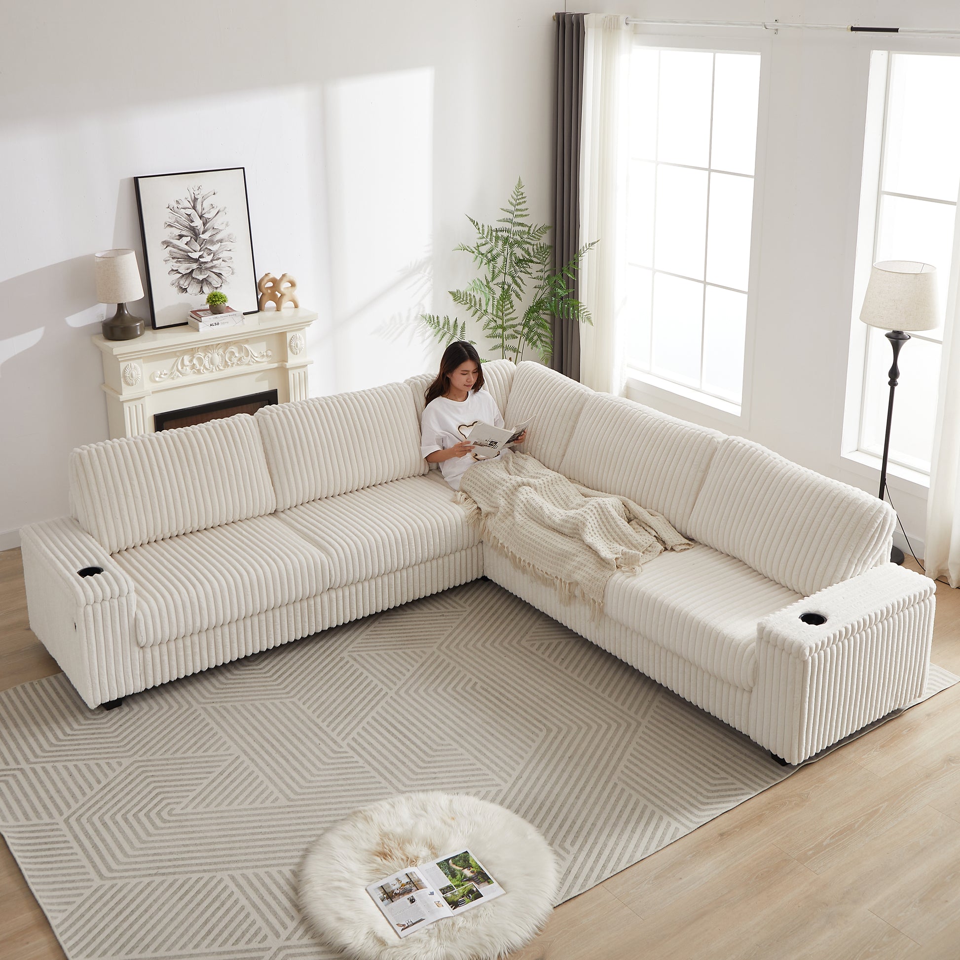 Plush cream corduroy sectional sofa with builtin cup holders perfect for a living room
