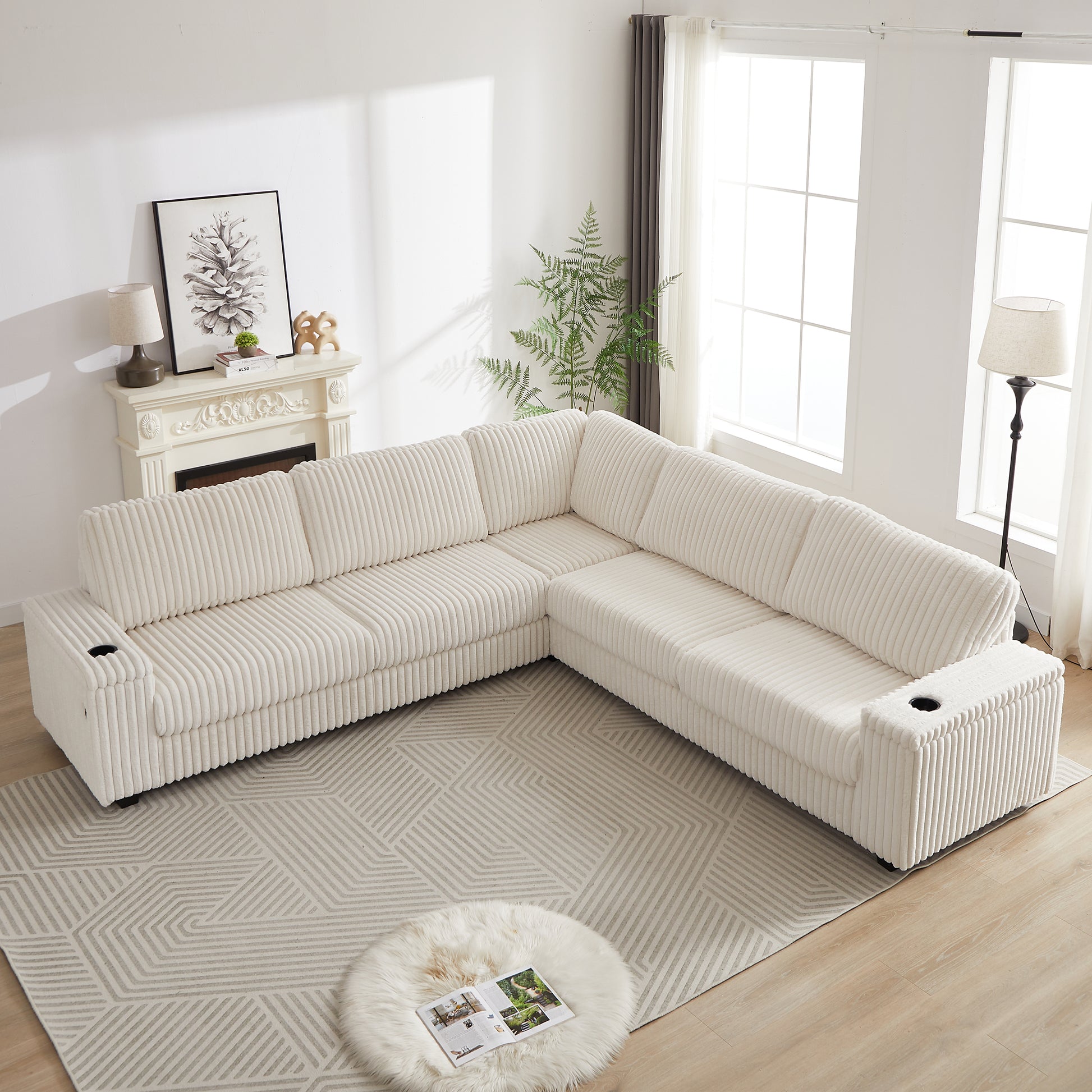 Plush white corduroy sectional sofa with builtin cup holders perfect for a modern living room