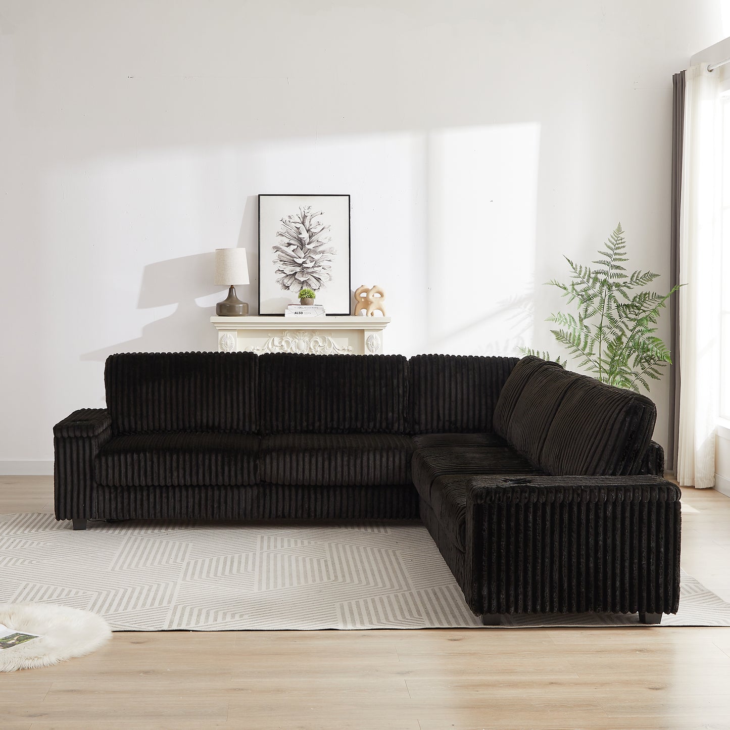 Black corduroy sectional sofa with deep cushions and a modern design