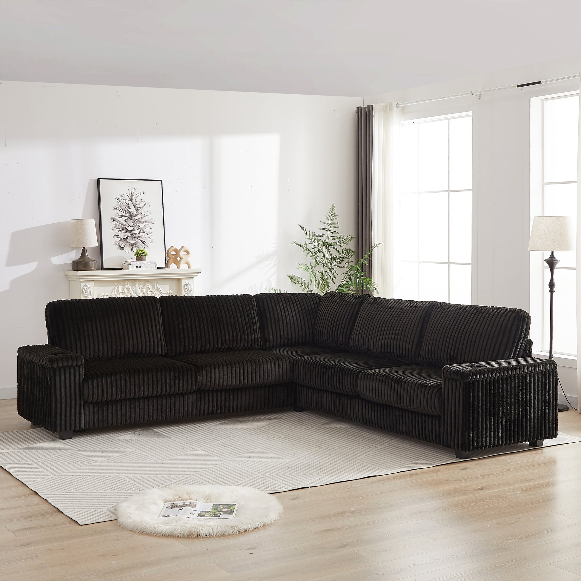 Dark corduroy sectional sofa with plush cushions in a modern living room