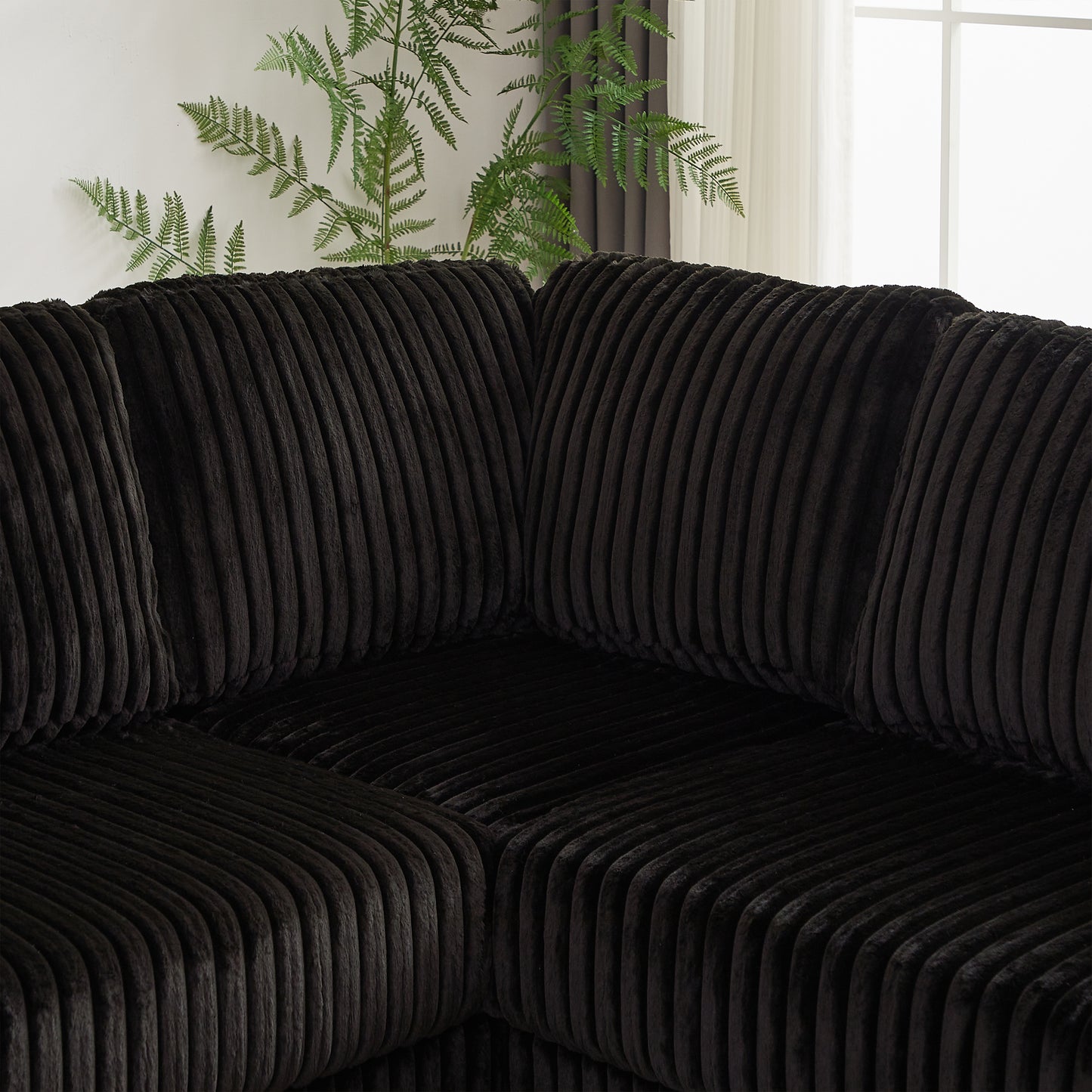Closeup of dark brown corduroy sofa cushions with plush texture