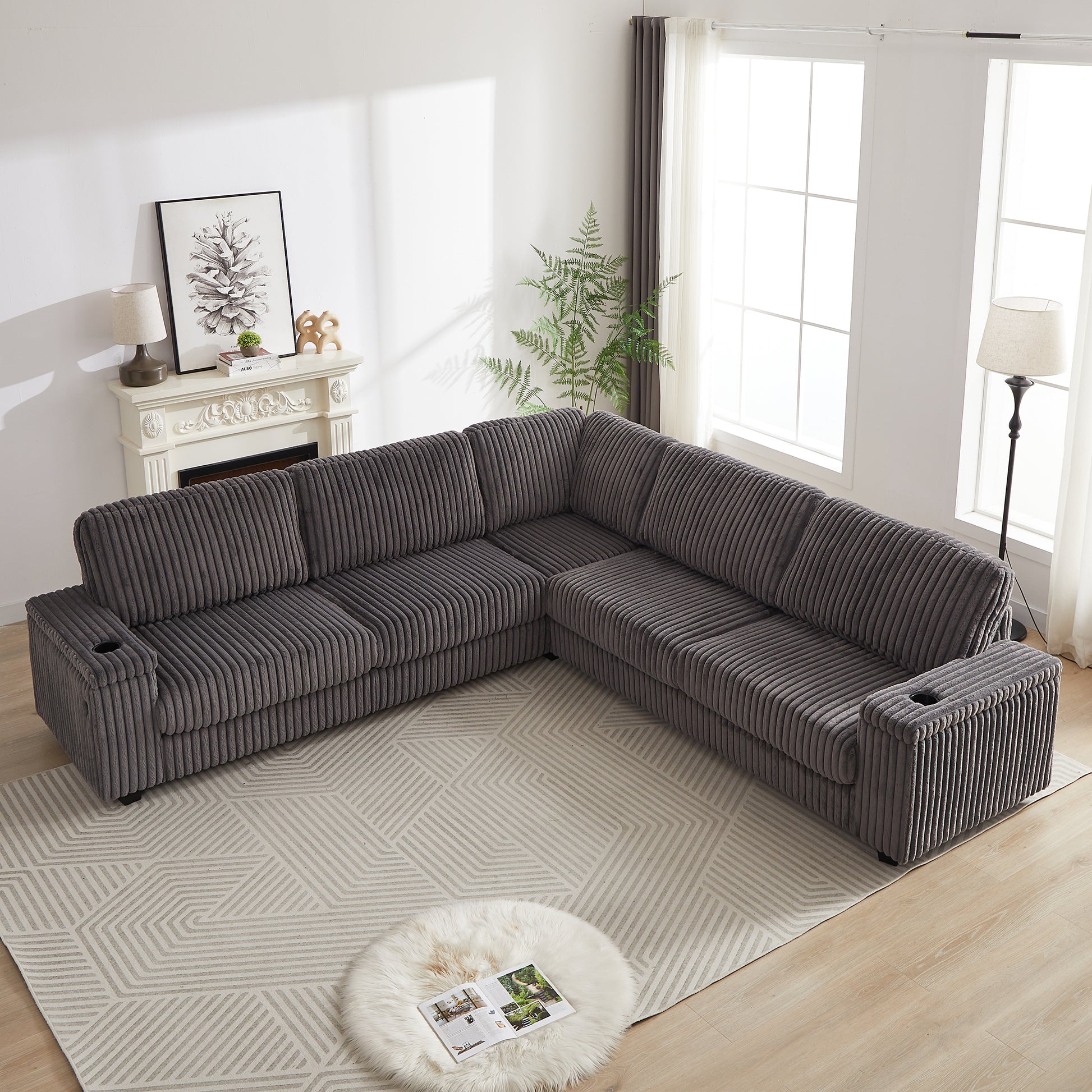 Dark gray corduroy sectional sofa with cup holders featuring a plush texture and modular design