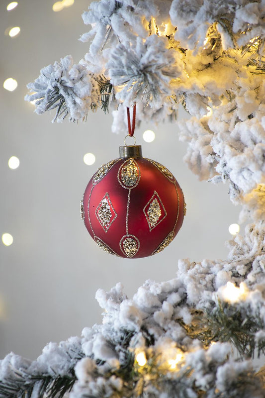 Red glass Christmas ornament with glitter diamond pattern