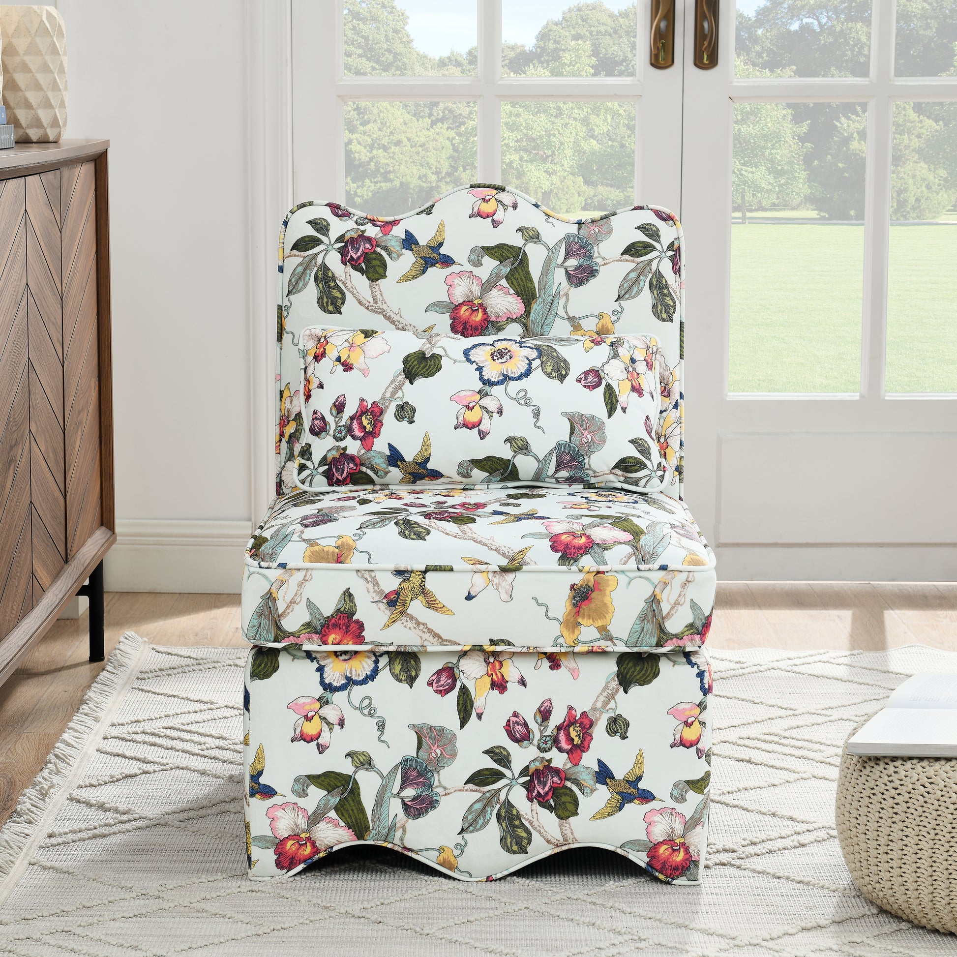 Slipper chair in light blue with colorful floral and bird print fabric for living room