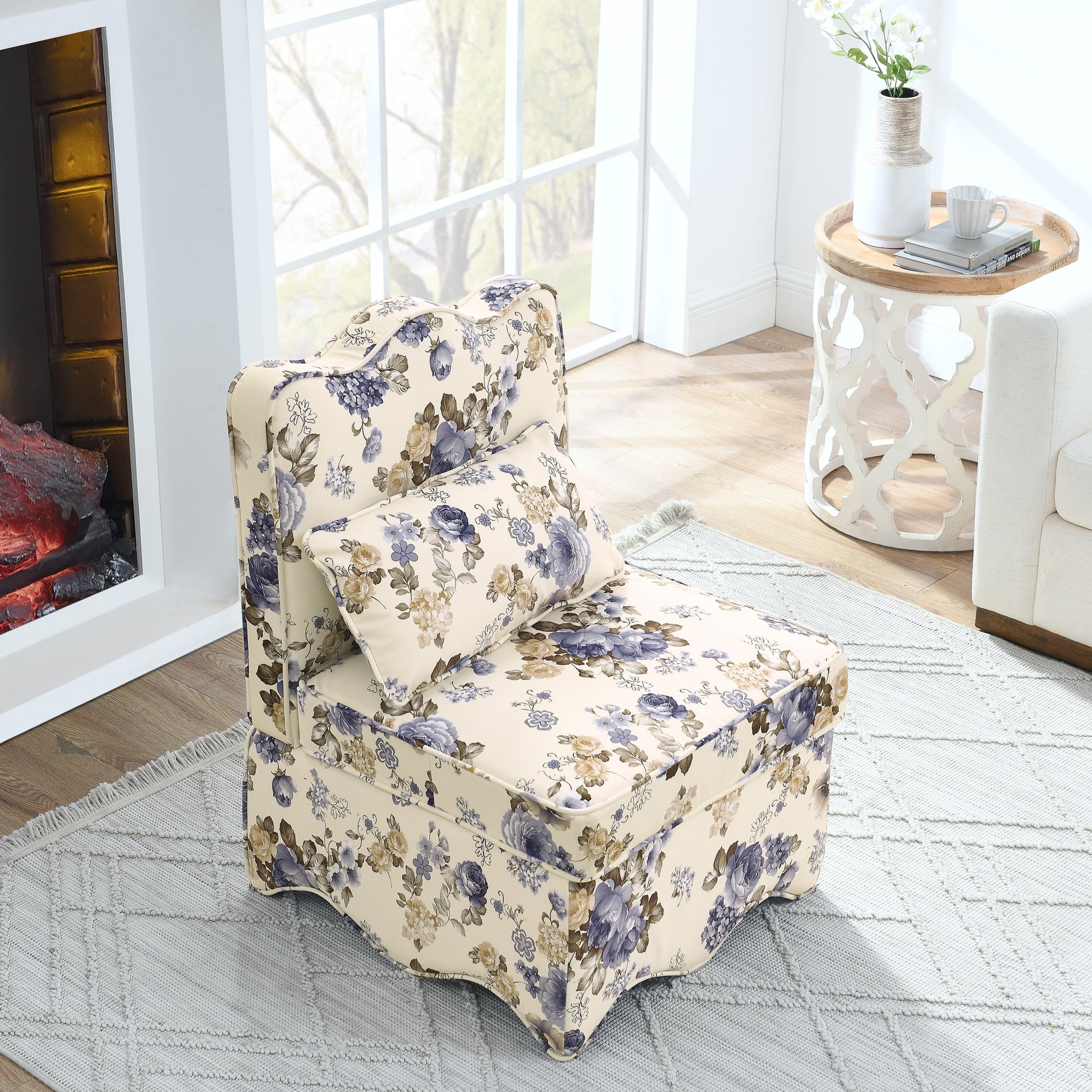 Cream fabric accent chair with blue and beige floral print featuring a plush cushion
