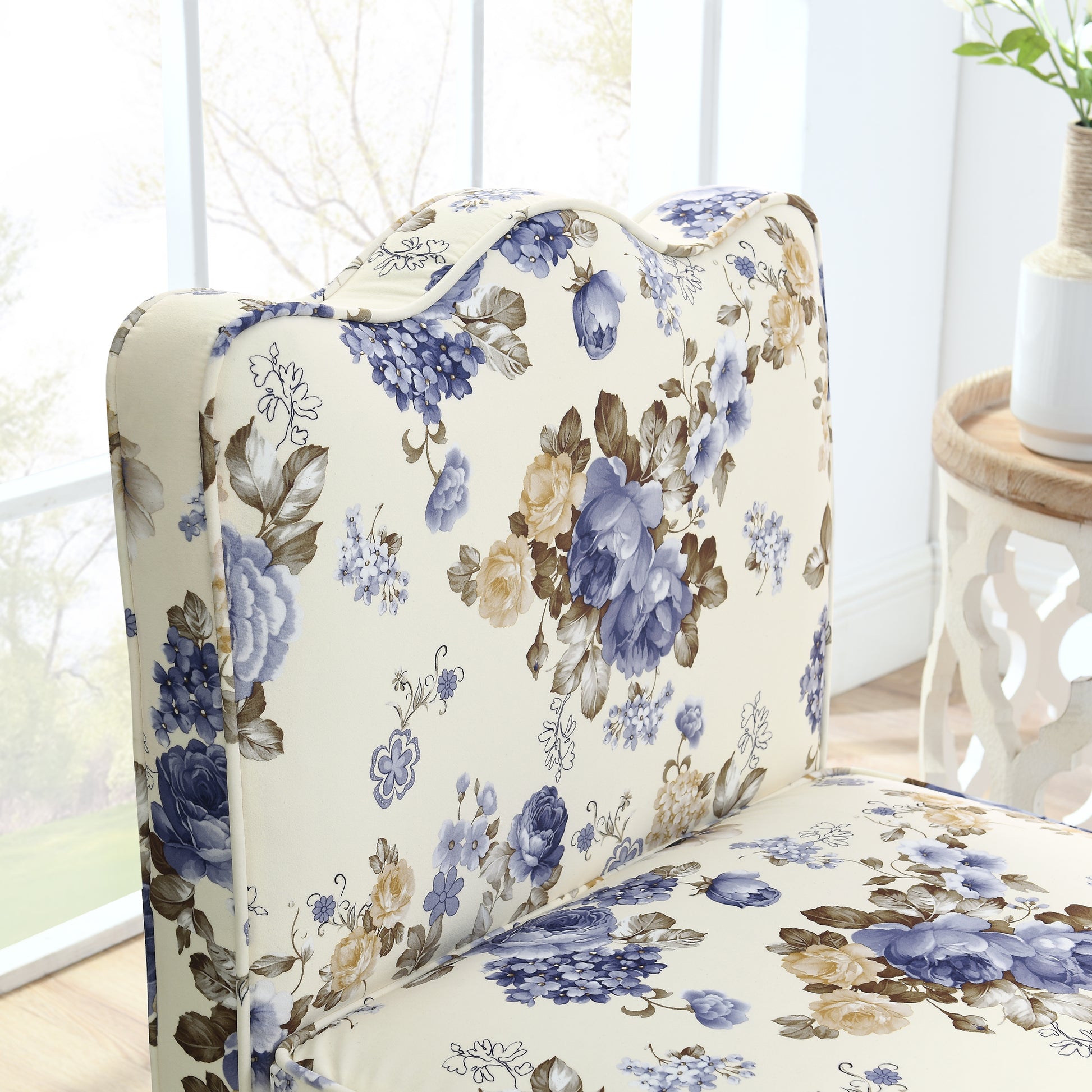 Cream fabric armchair with blue and yellow floral pattern elegant vintage style