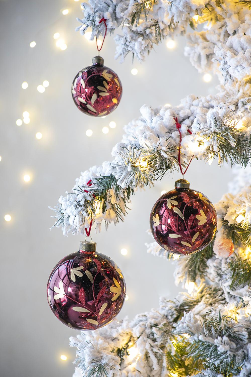 Shiny burgundy Christmas ornaments with gold floral design