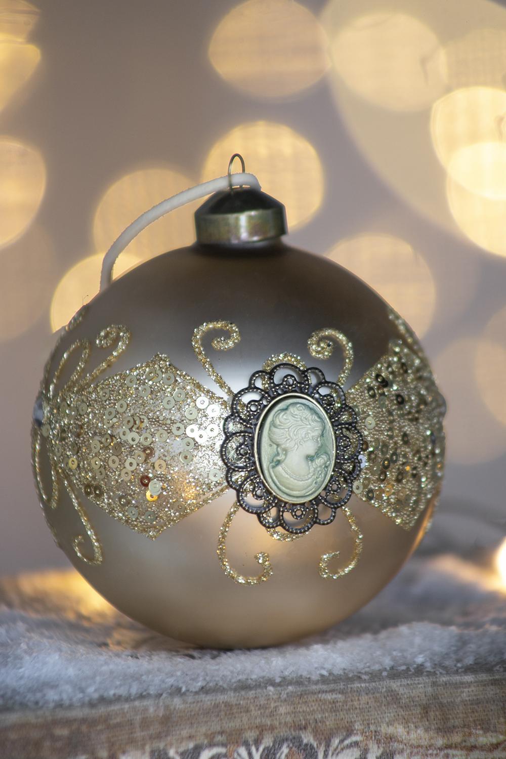 Champagne glass ornament with cameo and sequin detailing