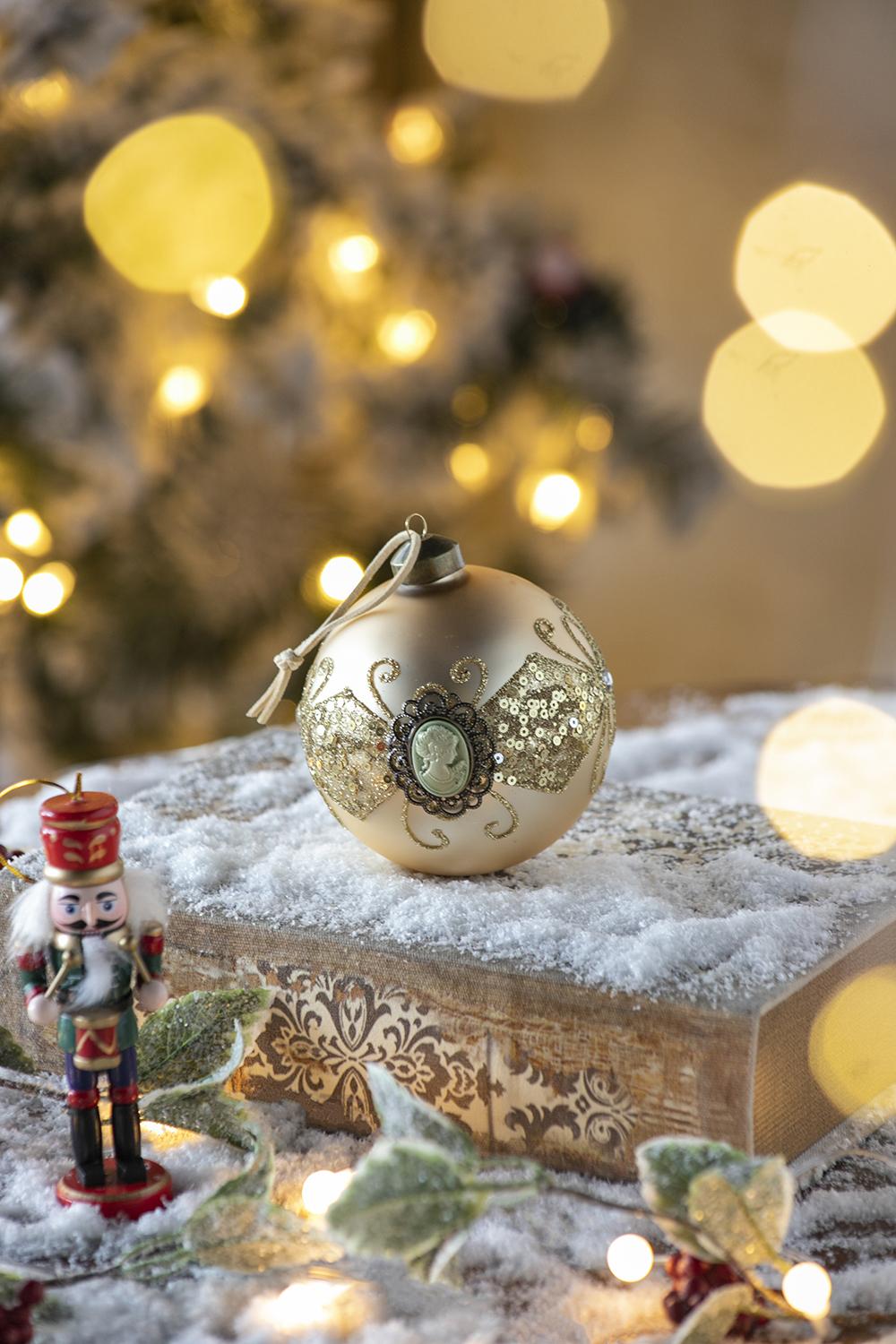 Elegant gold Christmas ornament with cameo and sequins  characters