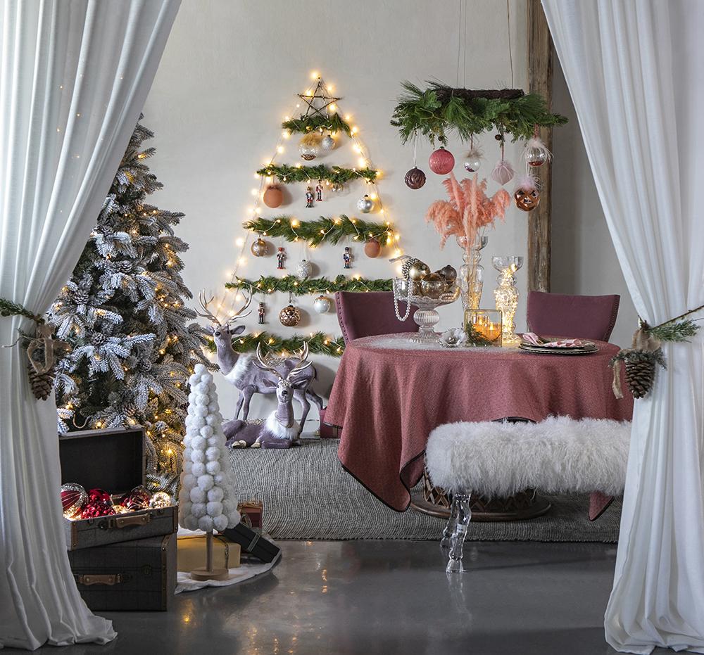 Flocked artificial Christmas tree with lights and pinecones festive holiday decor