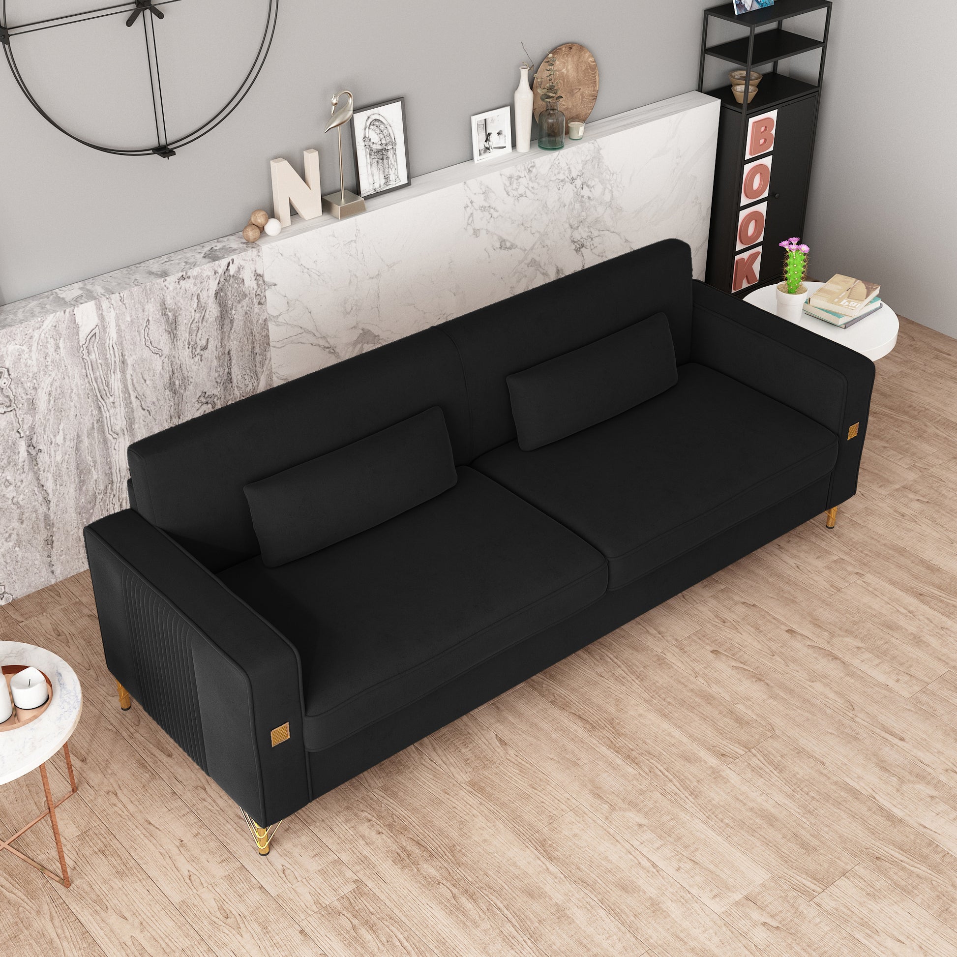 Elegant black velvet sofa with gold accents and plush cushions ideal for modern living rooms