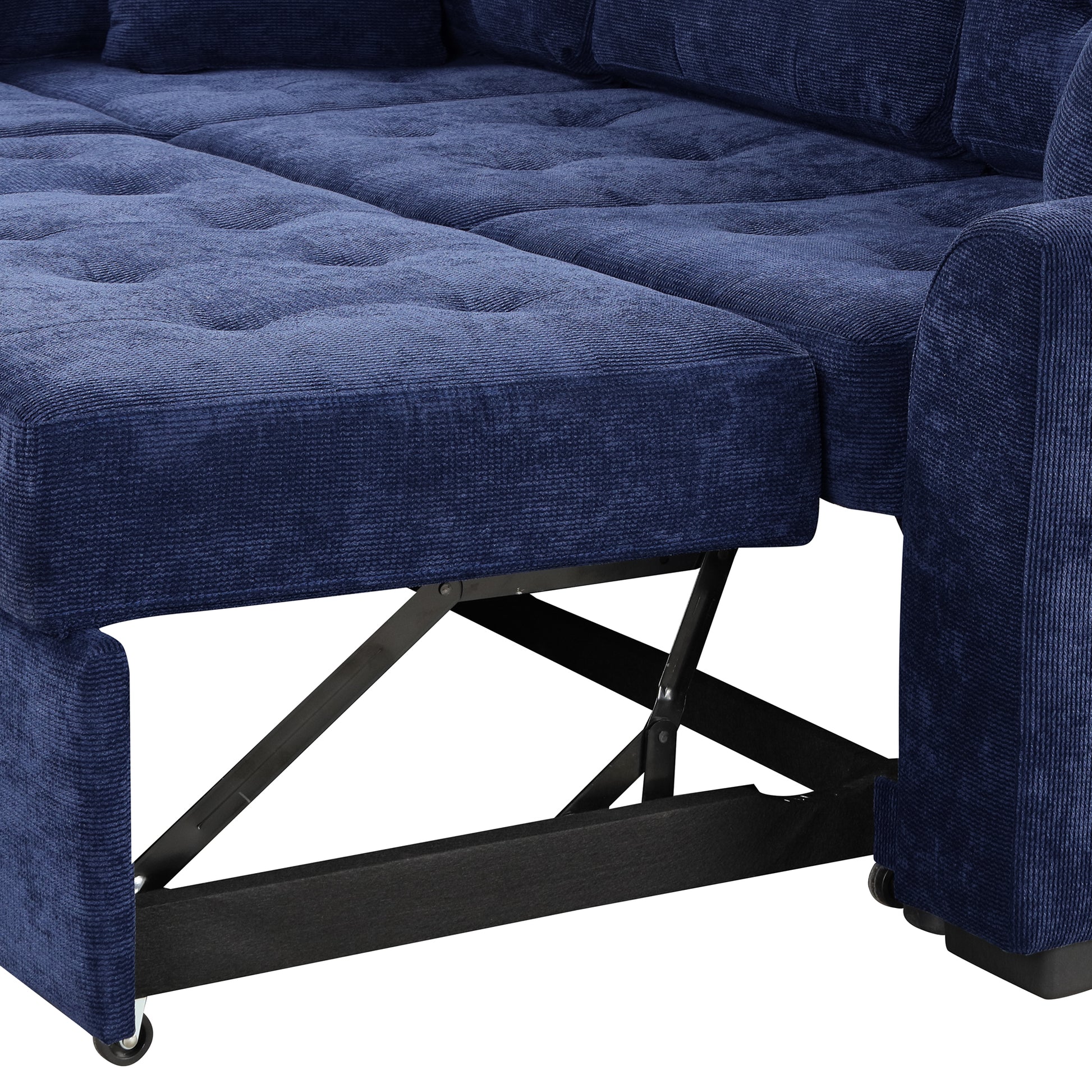 Navy blue corduroy sectional sofa with tufted seat cushions and exposed metal frame for ottoman