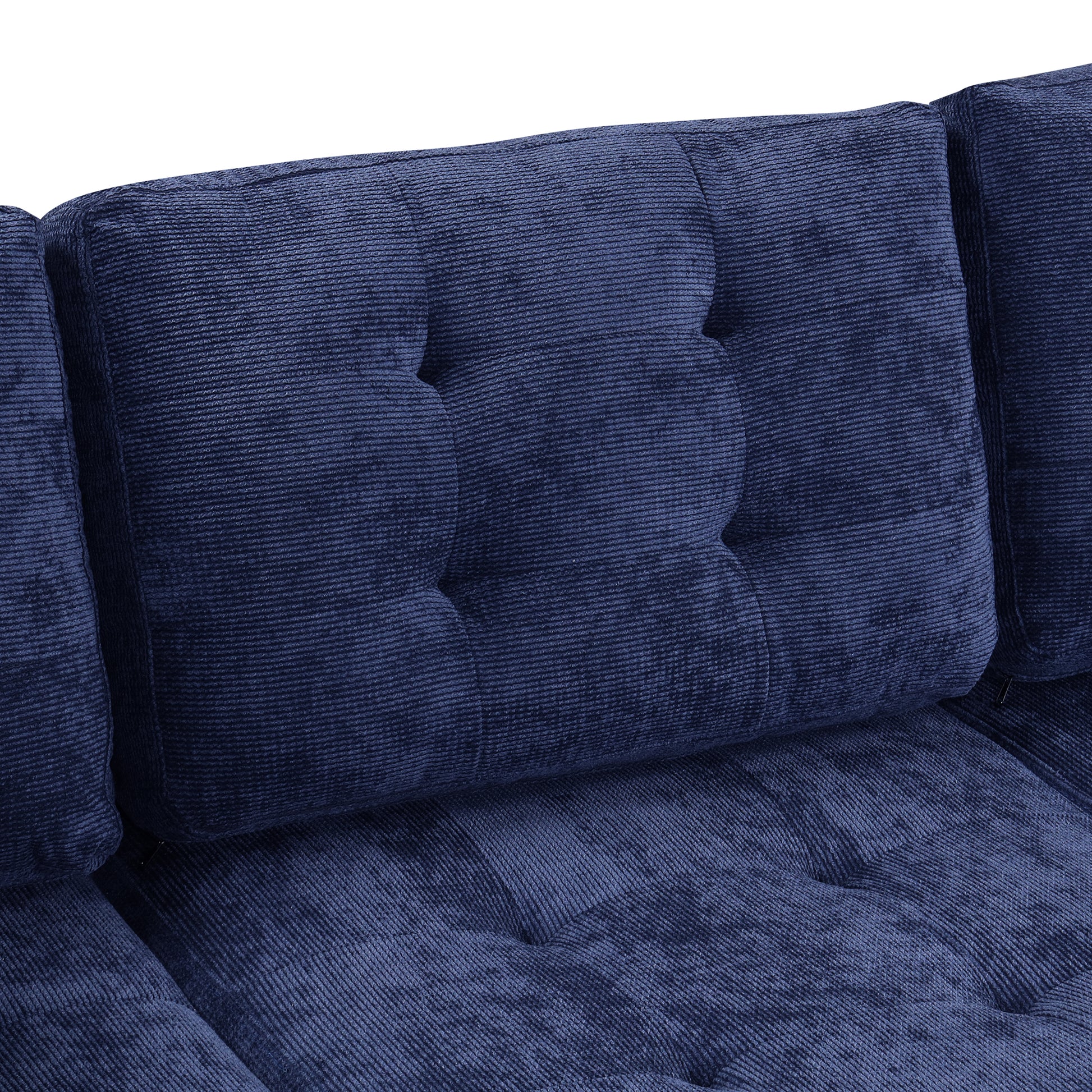 Dark navy corduroy sofa cushions with deep button tufting