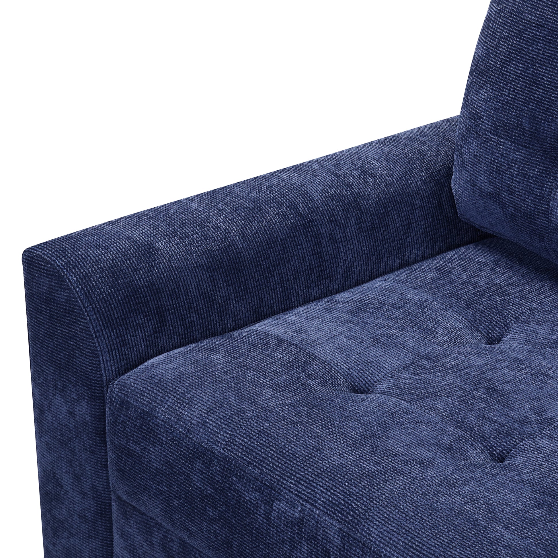 Dark blue textured fabric sofa armrest with tufted seat detail