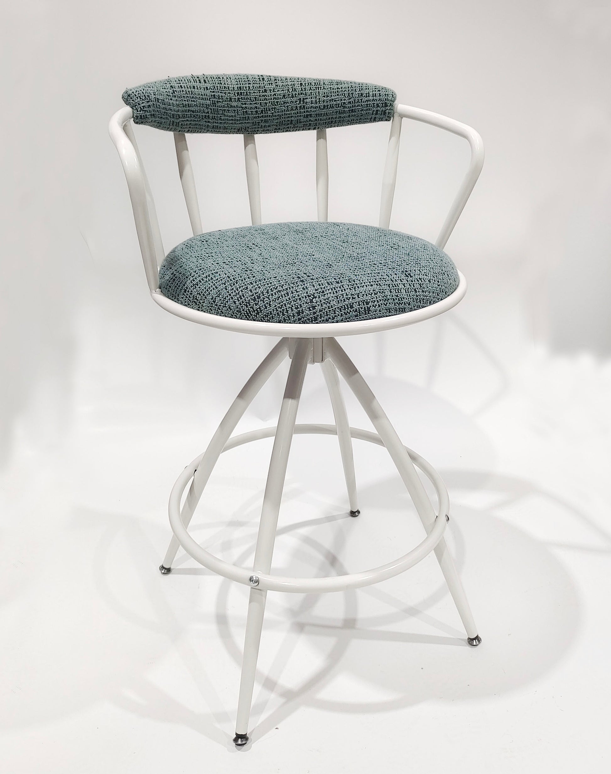 White metal swivel bar stool with teal textured fabric seat and backrest