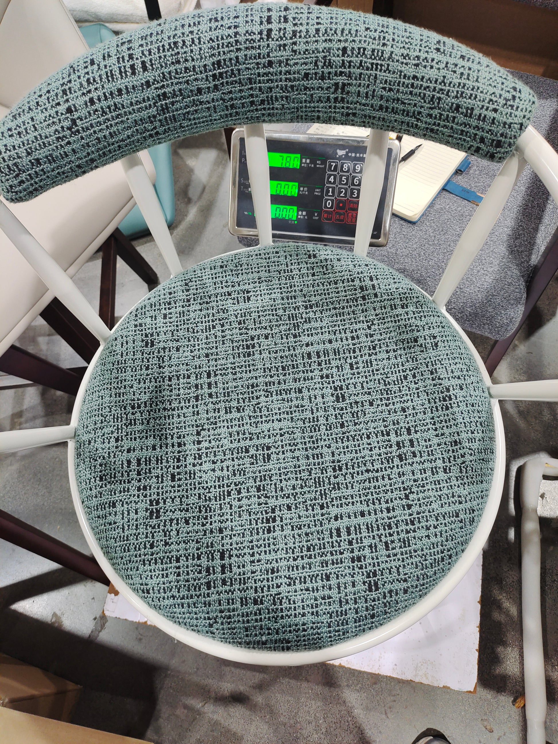 Light blue woven fabric armchair cushion with white frame