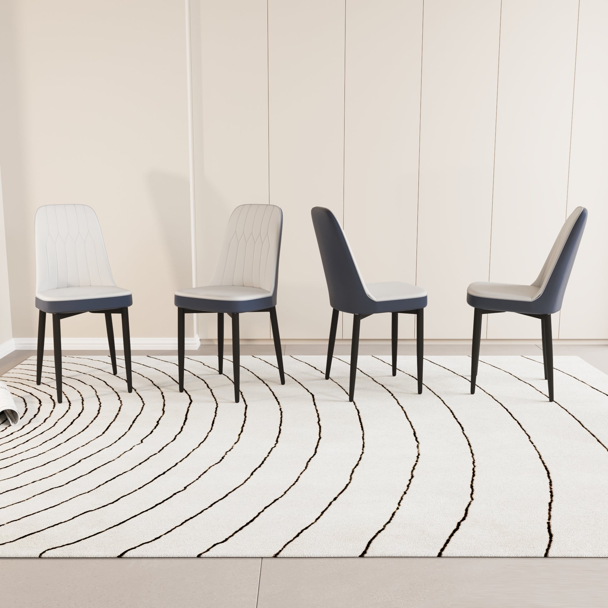 Four modern dining chairs with cream upholstery and navy accents on black legs