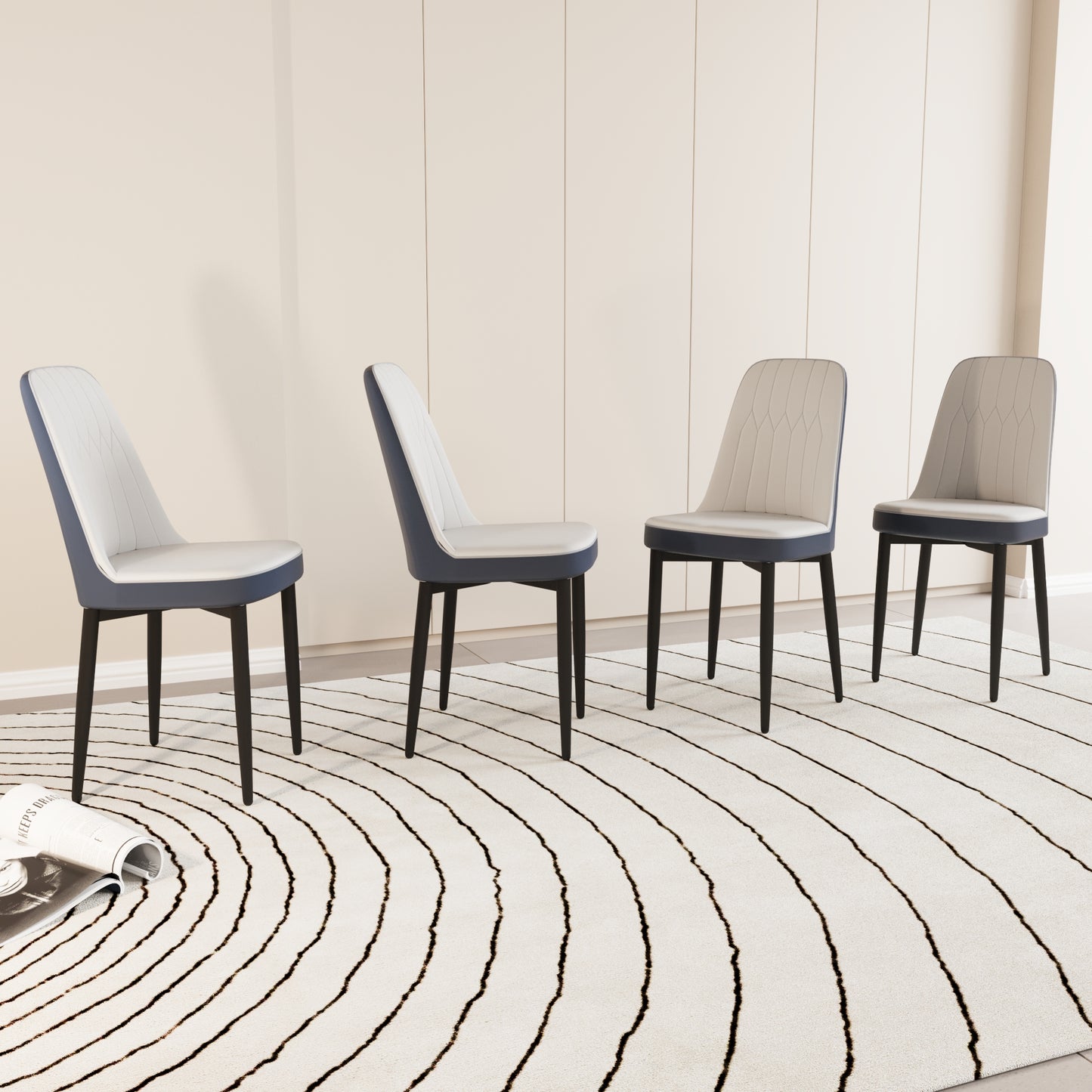 Set of four modern dining chairs with grey upholstered seats and navy blue accents