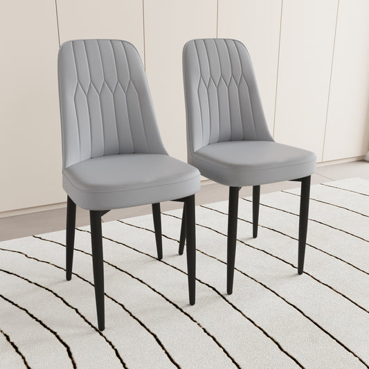 Two light gray upholstered dining chairs with vertical stitching detail and black legs
