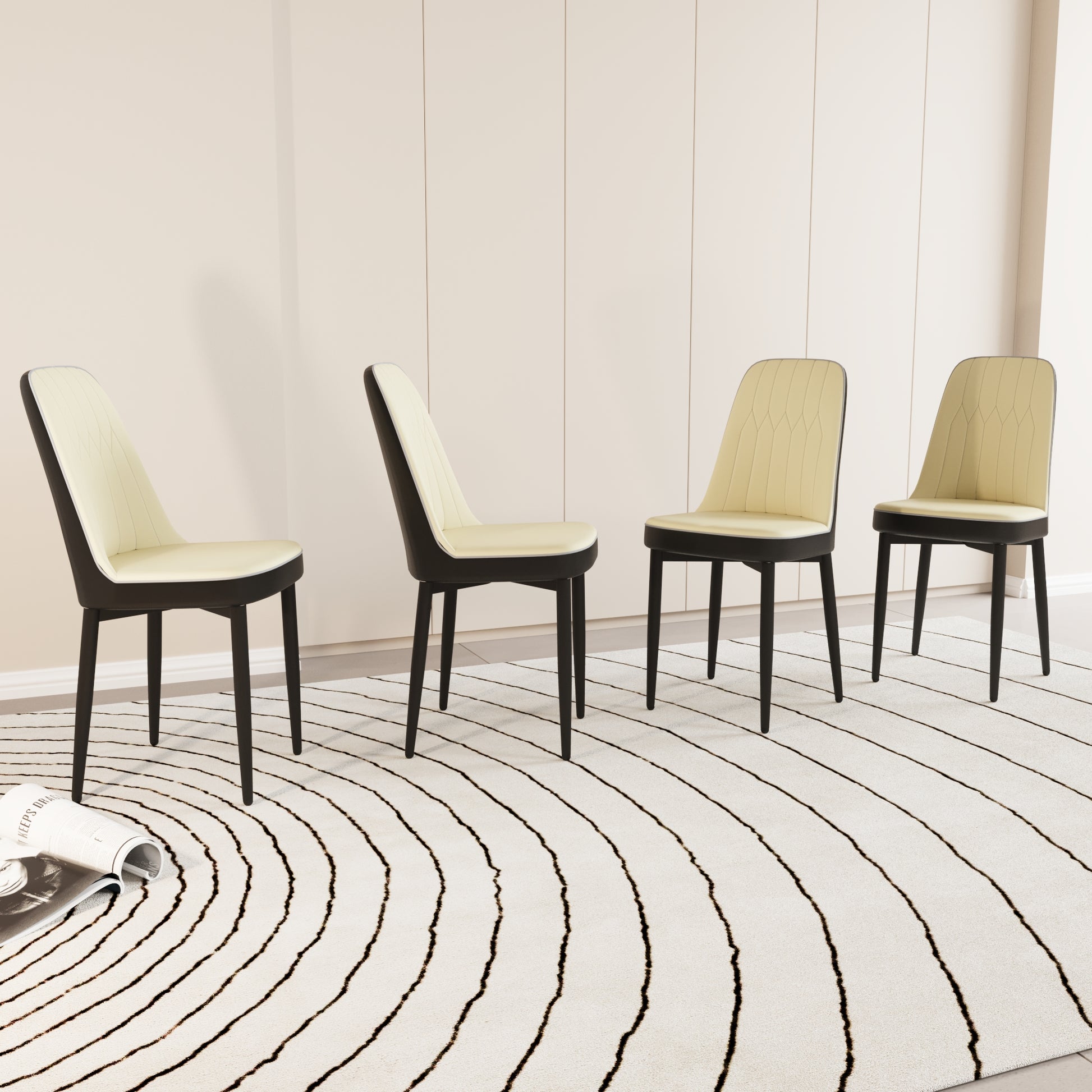 Four contemporary dining chairs with cream upholstered seats and black frames arranged on a patterned rug