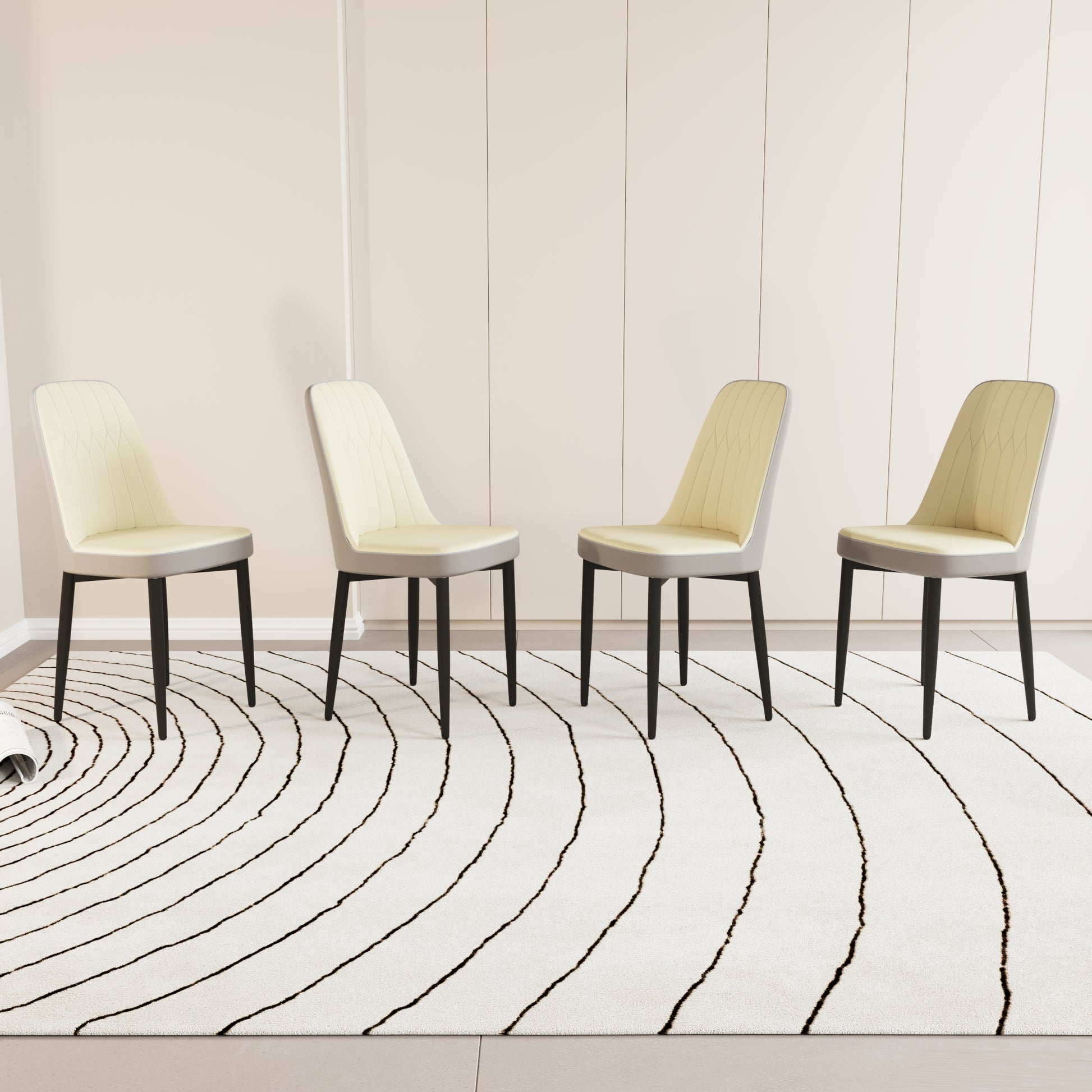 Four cream upholstered dining chairs with gray accents and black legs