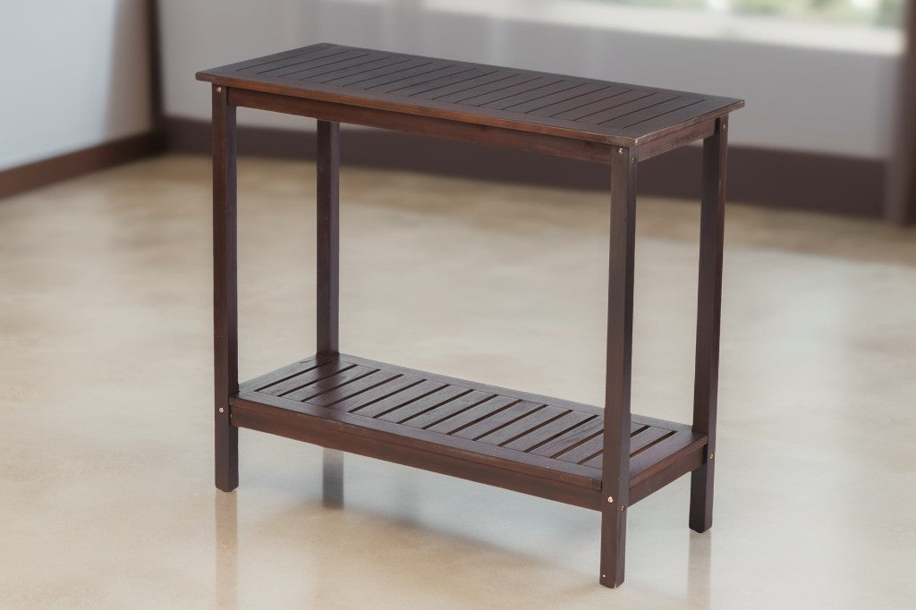 Dark brown wooden console table with two slatted shelves for entryway storage