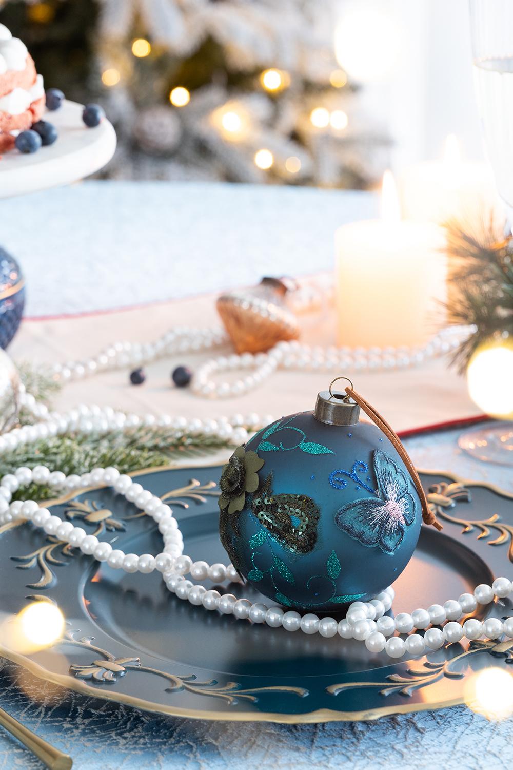 Teal glass Christmas ornament with embroidered butterfly and floral design  characters