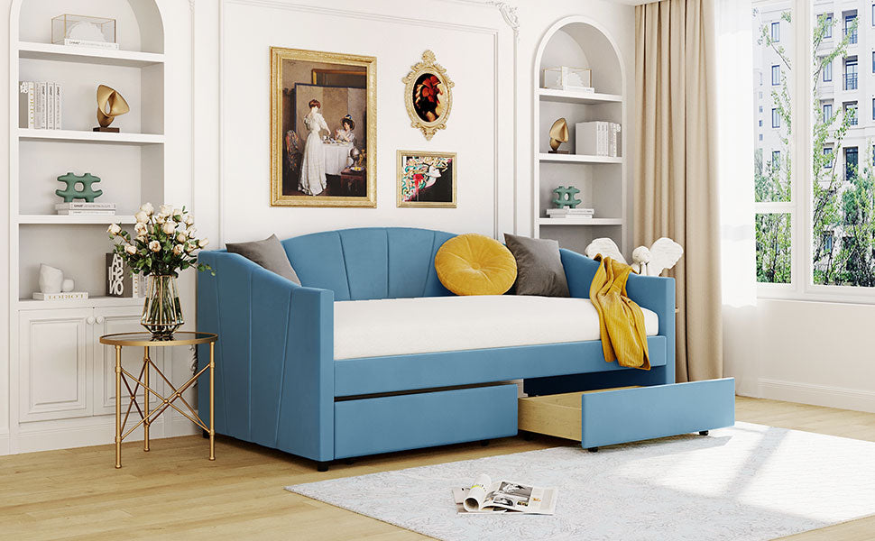 Blue upholstered daybed with pullout drawer and yellow accent pillow