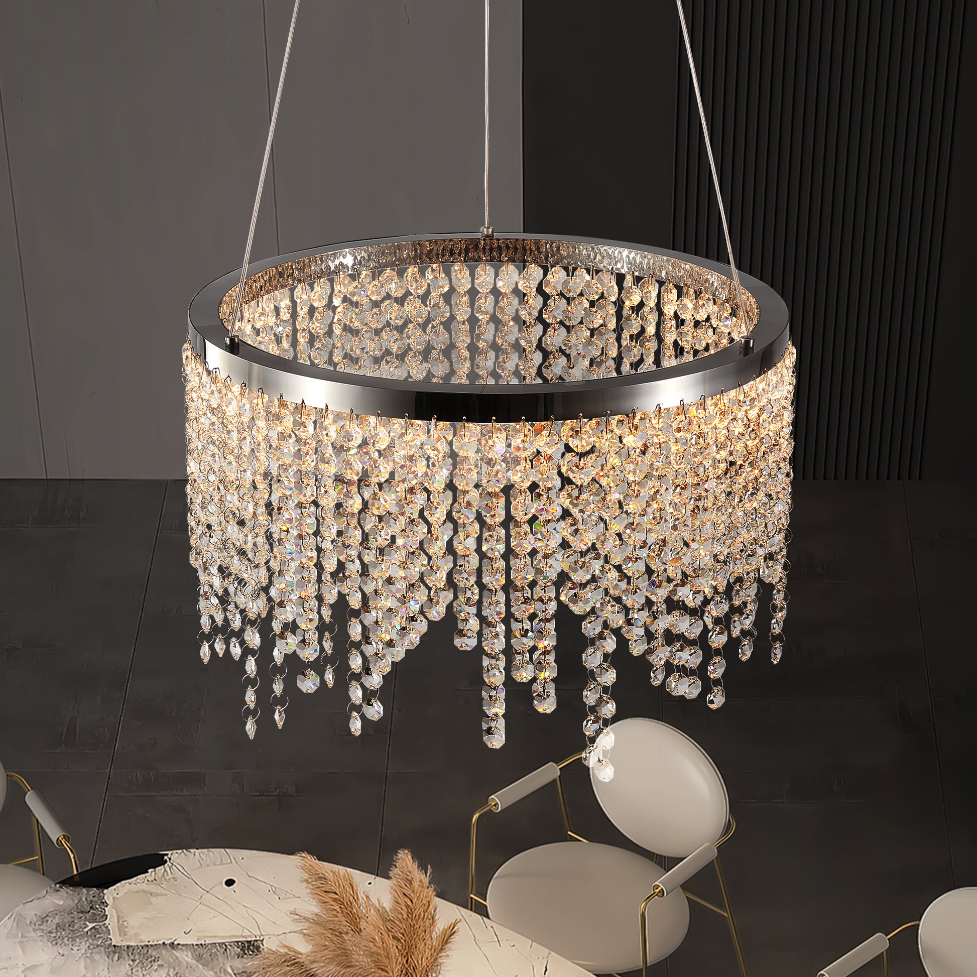 Circular crystal chandelier with chrome finish illuminating a modern dining room setting