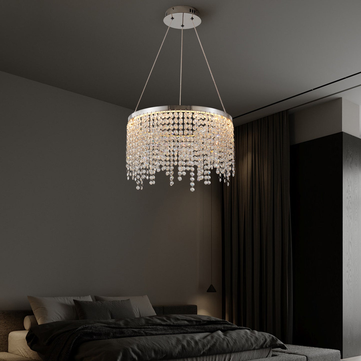 Elegant crystal chandelier with a circular design and cascading beads perfect for modern dining rooms