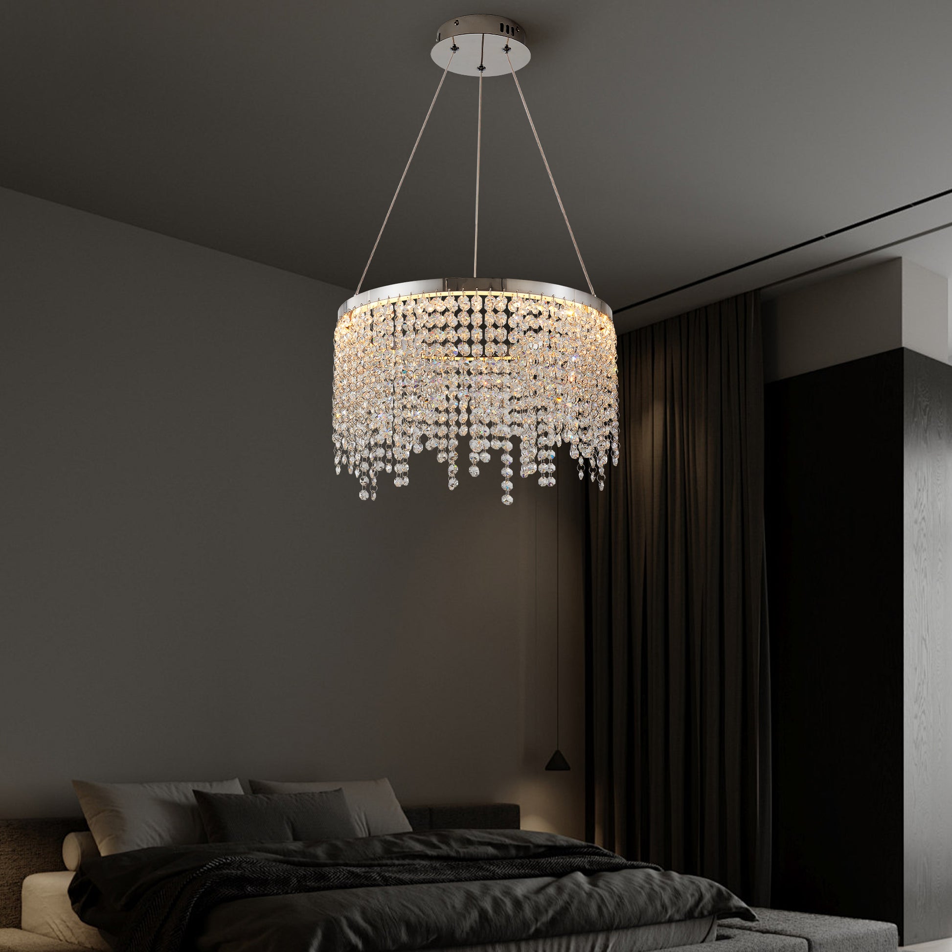 Elegant crystal chandelier with a circular design and cascading beads perfect for modern dining rooms